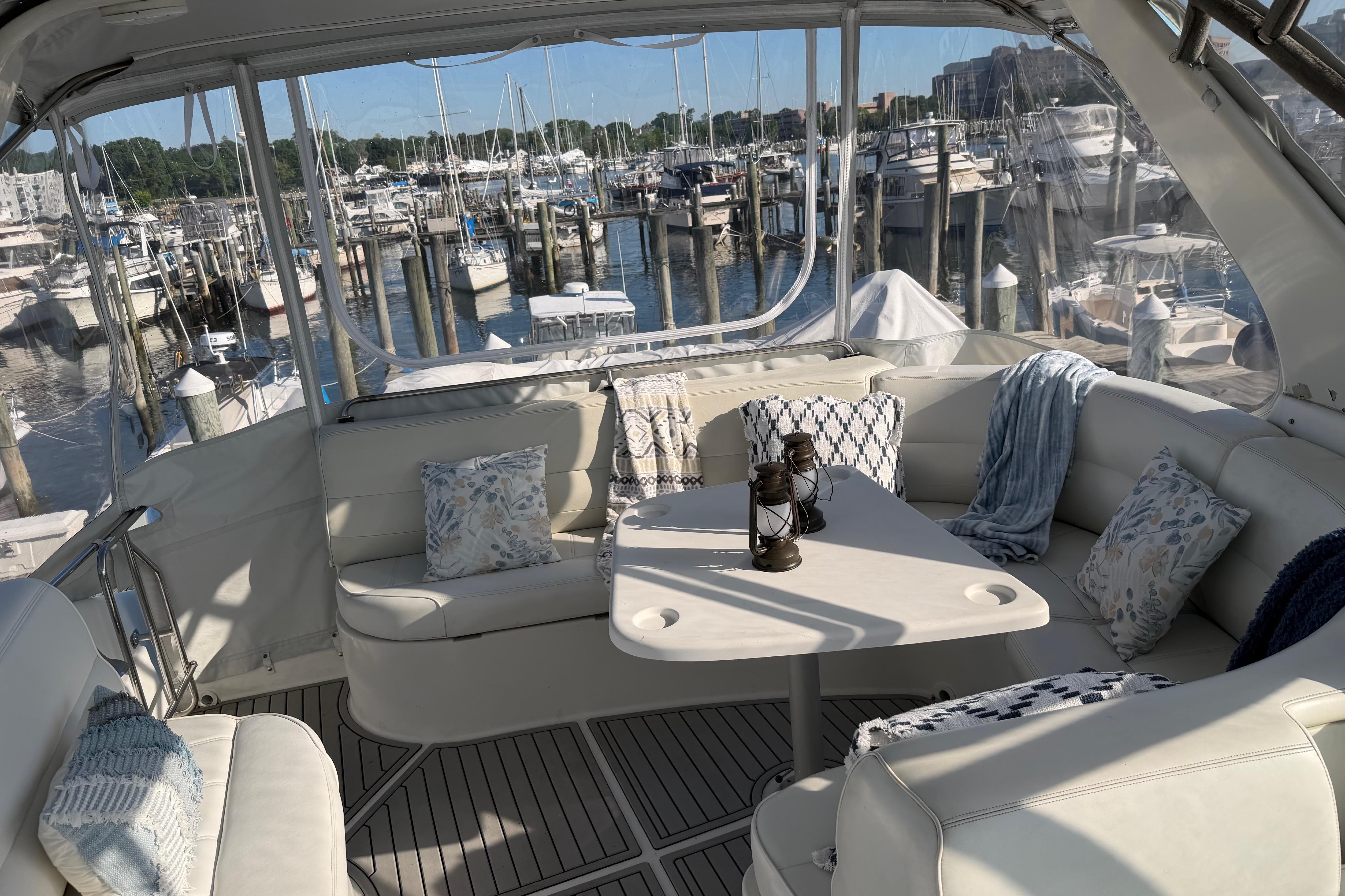 Luxurious 1999 Carver 530 Voyager Pilothouse yacht interior with marina view.