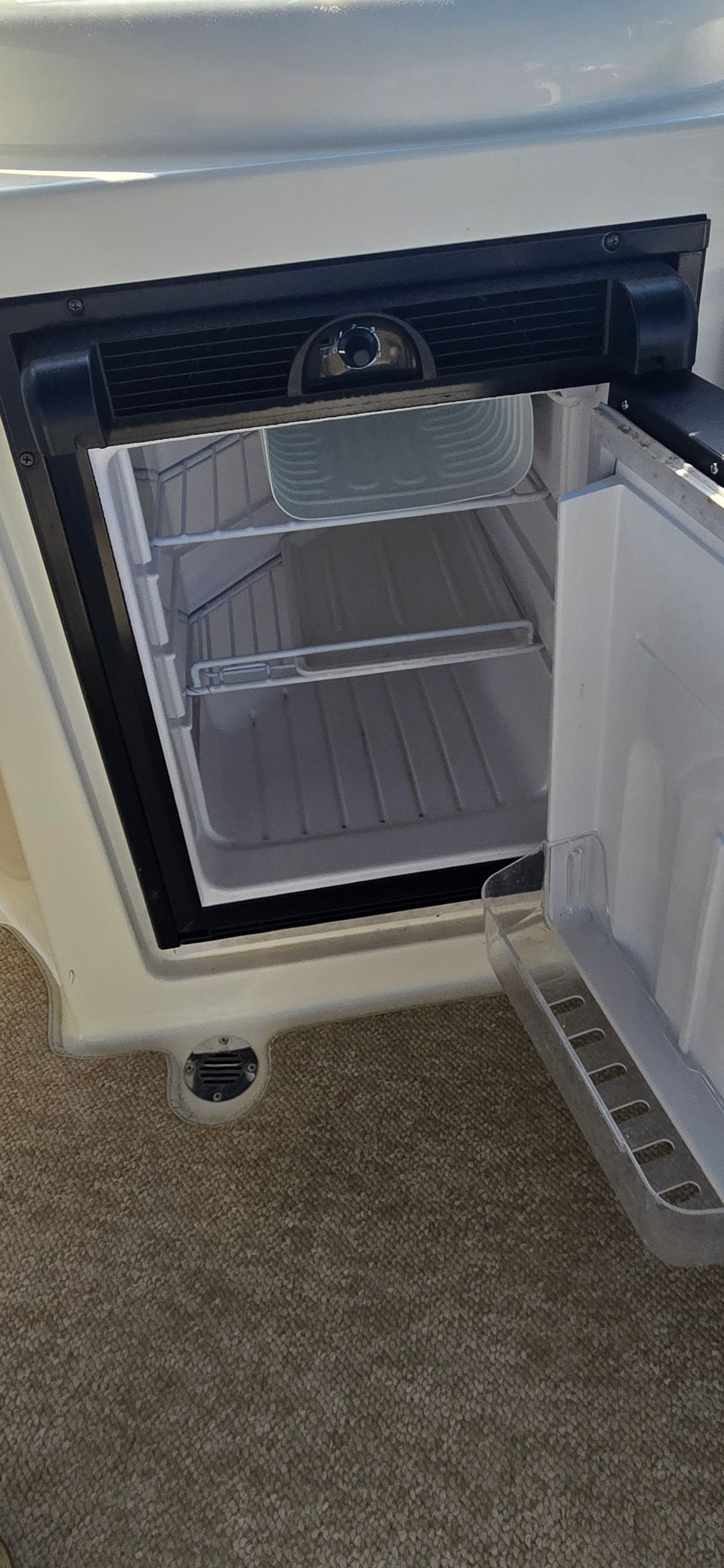Open fridge in a 2007 Meridian 341 Sedan yacht.