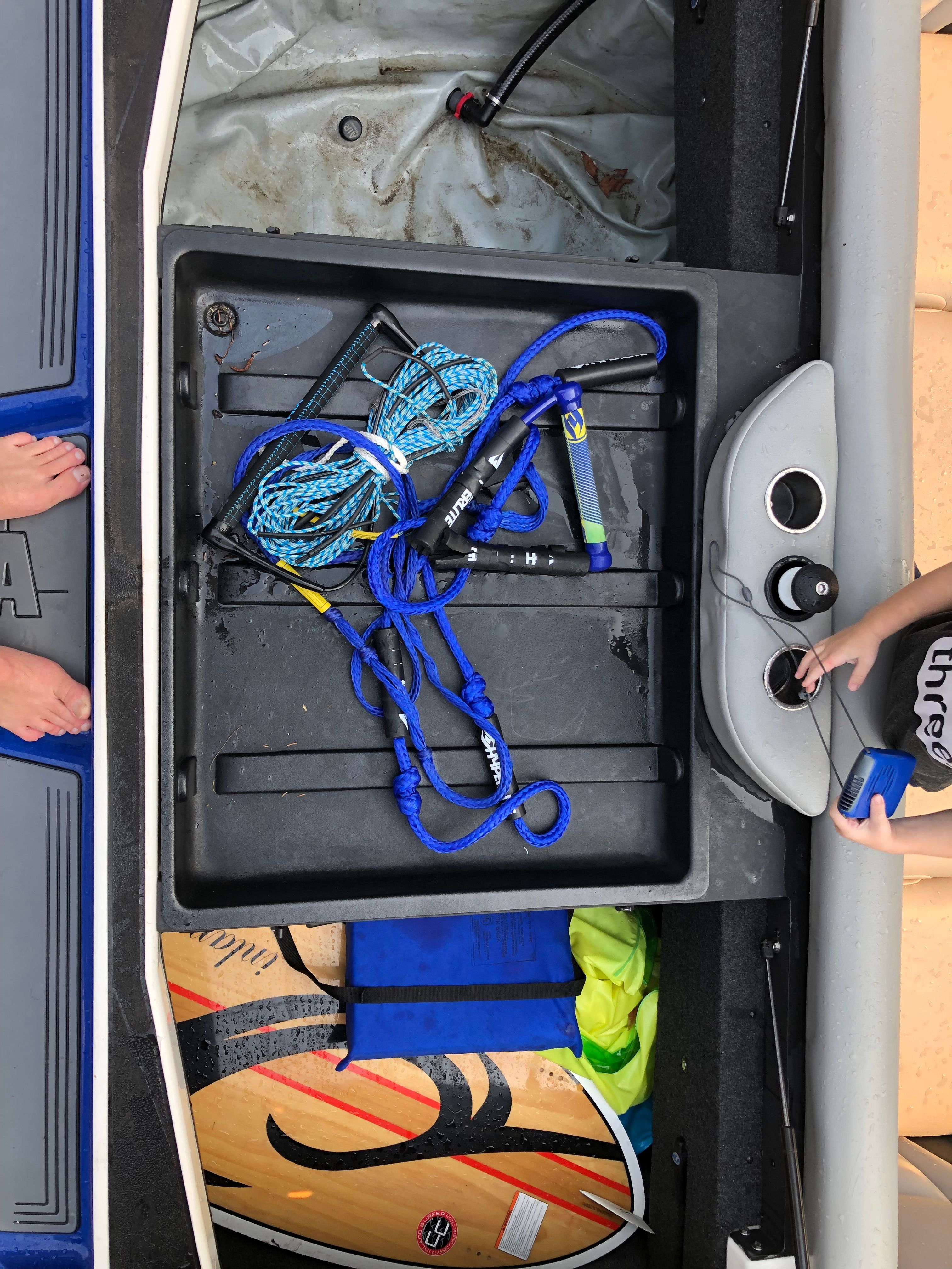 Boat storage with rope, surfboard, and accessories, Custom a22, 2015.