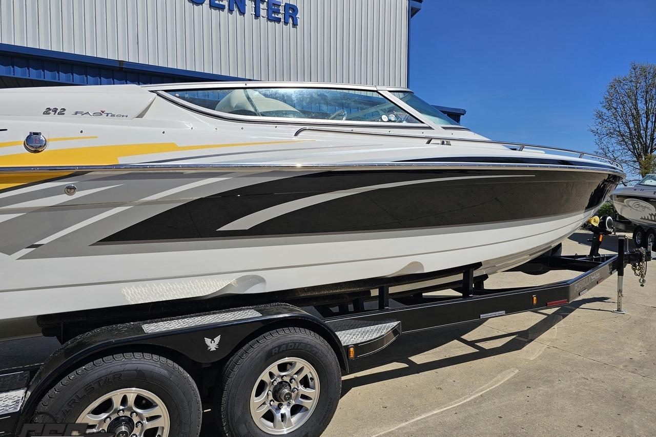 2014 Formula 292 FASTech boat on trailer, sleek design, parked outdoors.