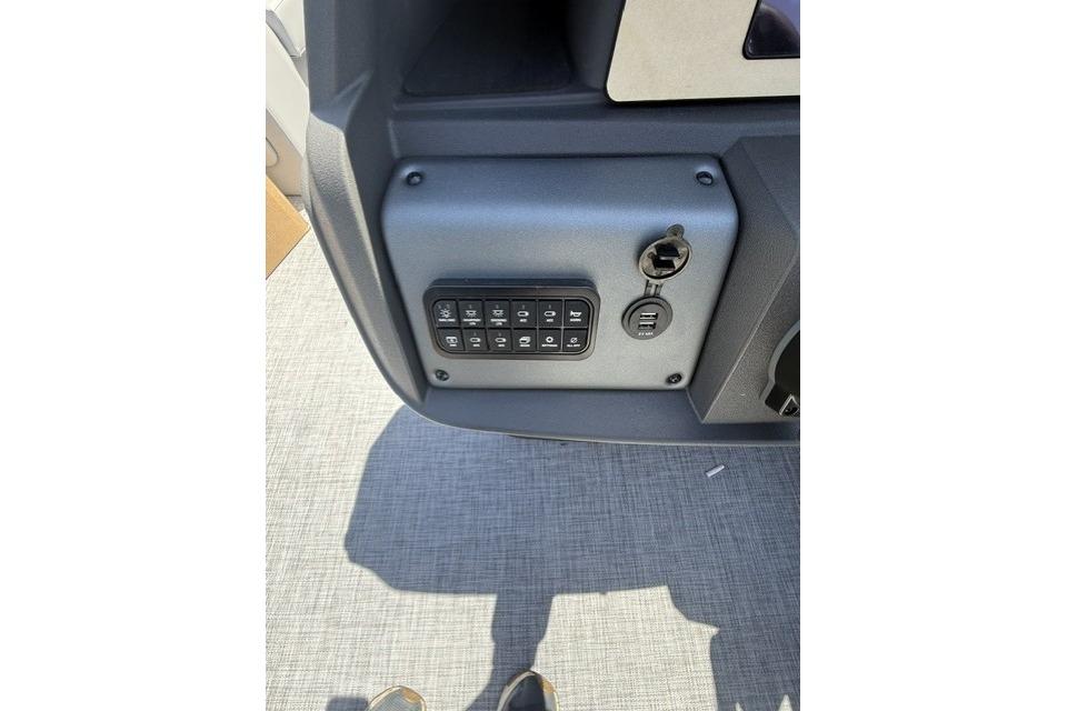 Control panel of 2026 Sun Tracker Party Barge 18 DLX with keypad and USB ports.