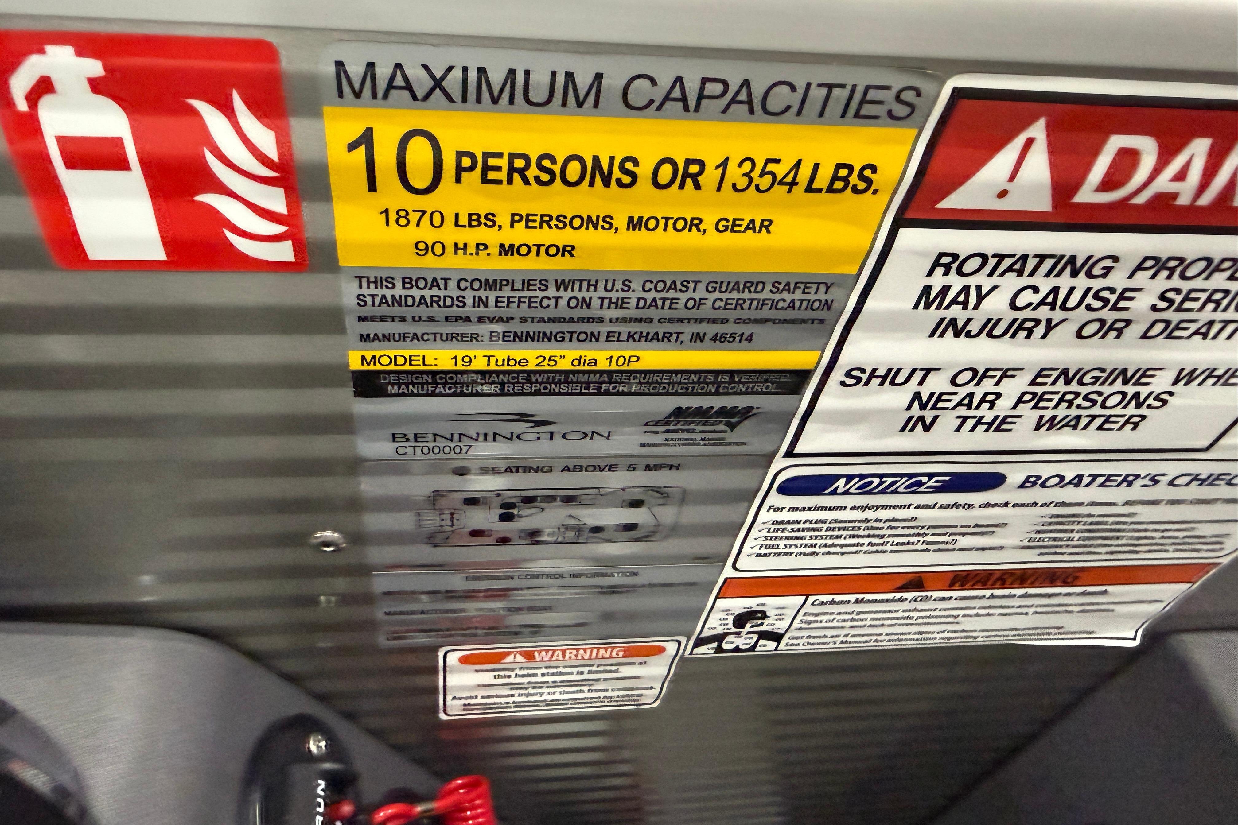 Safety and capacity labels on a 2026 Bennington 20 SF boat.