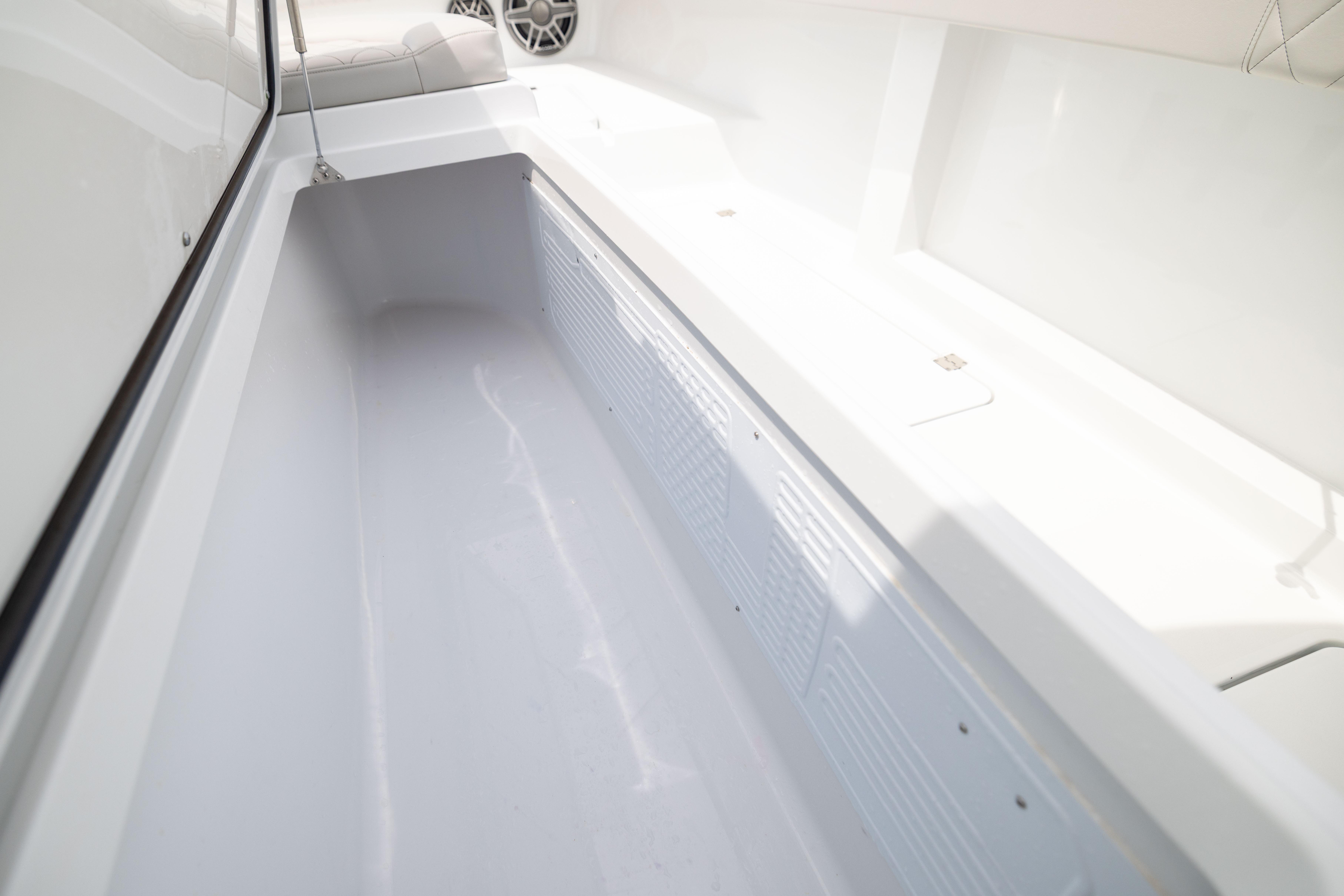 Spacious interior of 2025 Freeman 42 LR boat, featuring sleek white design.