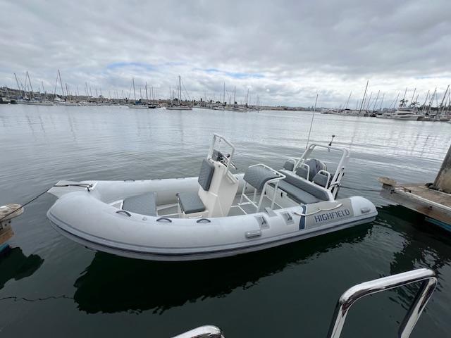 2017 Highfield OM 500 inflatable boat docked in a marina.
