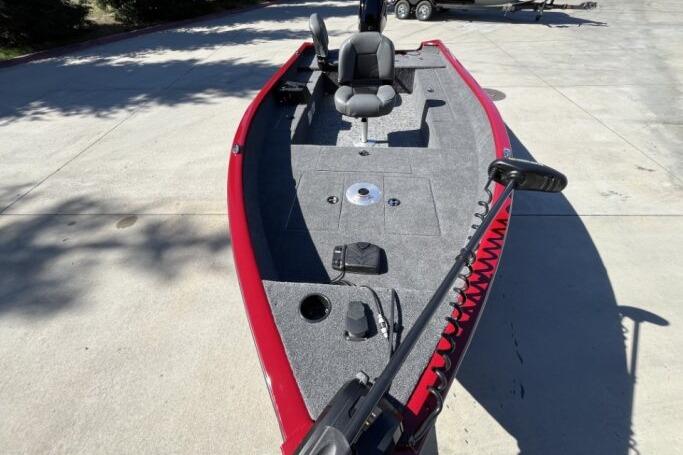 2025 Tracker Super Guide V-16 T fishing boat with red trim and spacious deck.