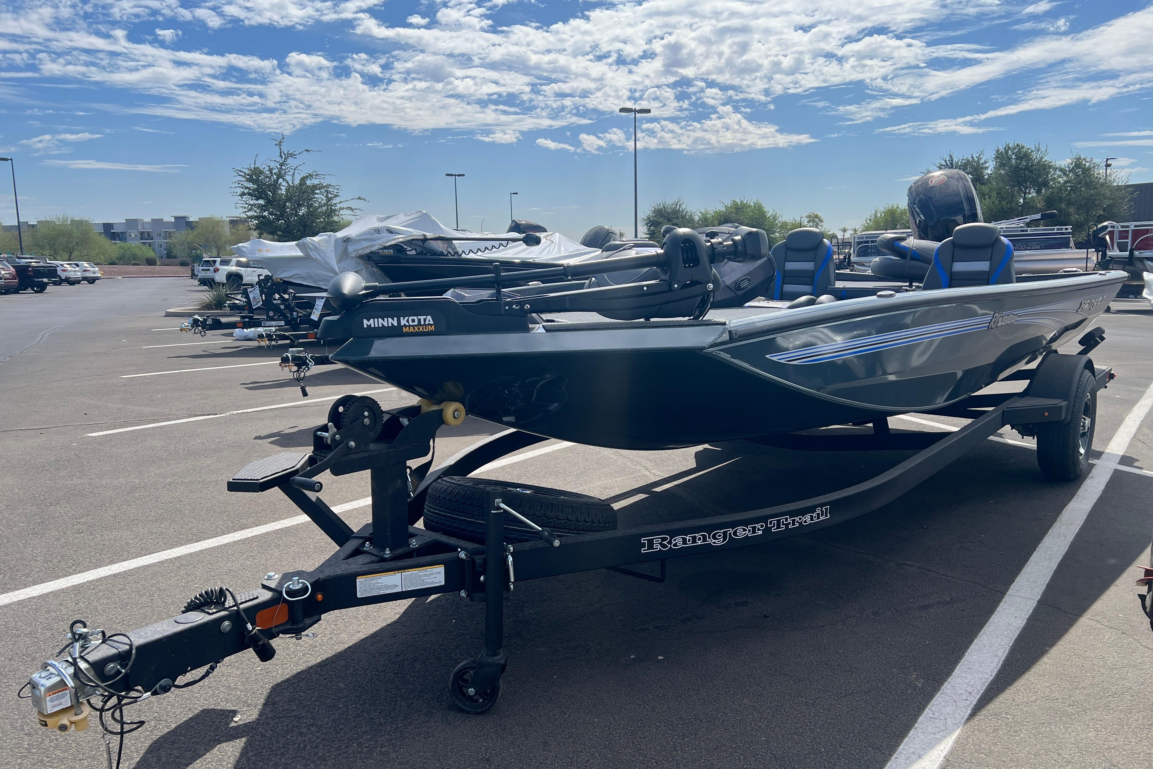 2026 Ranger RT188P boat on trailer in parking lot under blue sky.