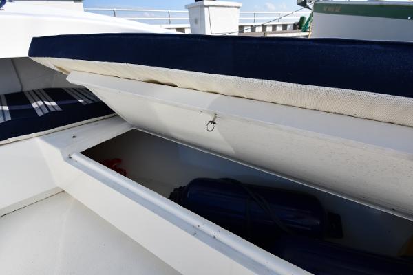 Open storage compartment on a 2021 Eastern 248 Center Console boat.