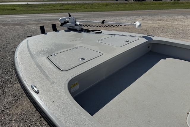 2025 Majek 24 Reaper boat deck with storage compartments and trolling motor.