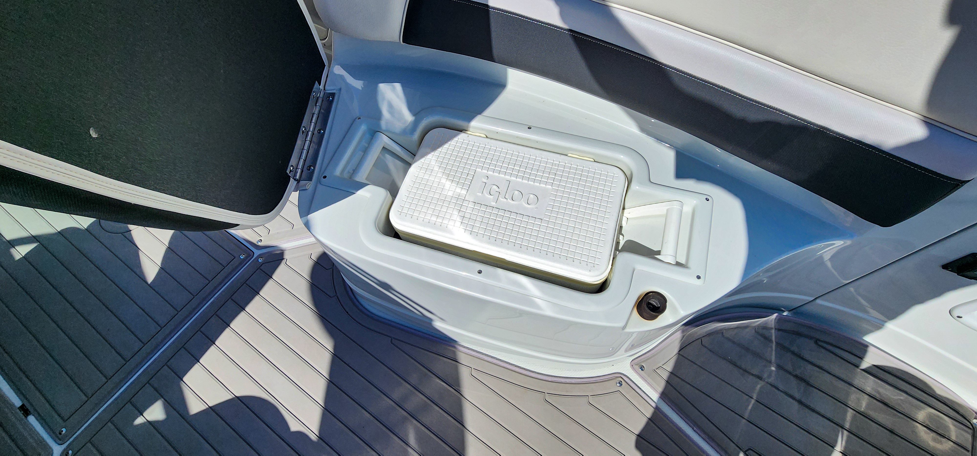 A built-in Igloo cooler in a 2017 Crownline 285SS boat.