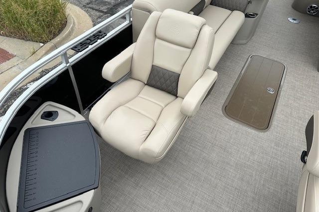 2025 Sun Tracker Sportfish 24 XP3 interior with beige seating and modern design.