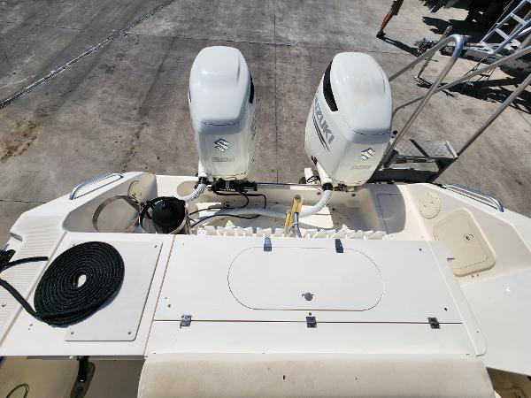 2005 Pursuit 3070 Offshore Center Console boat with dual Suzuki outboard engines.