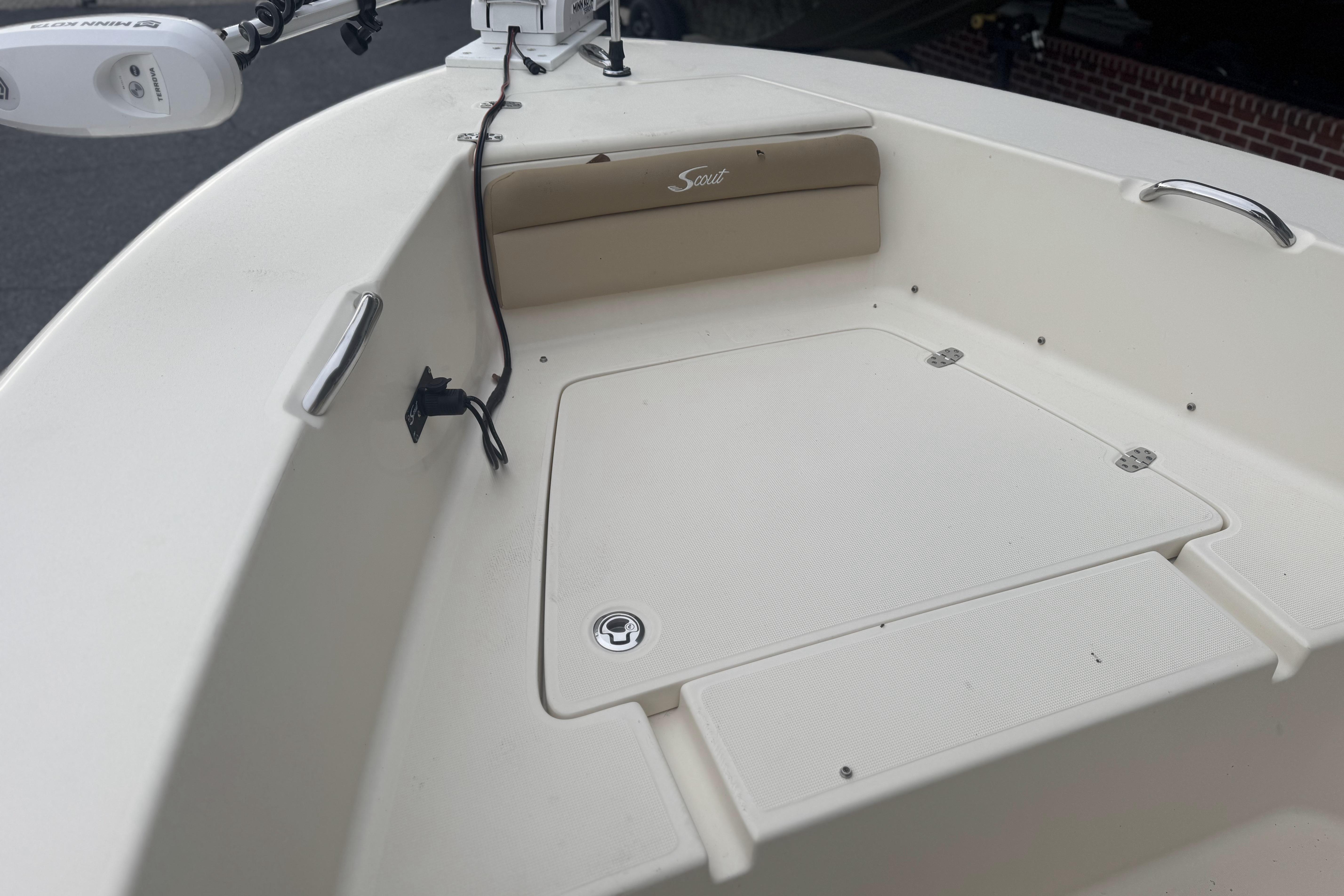 2020 Scout 195 Sportfish boat interior with storage compartment and seating.
