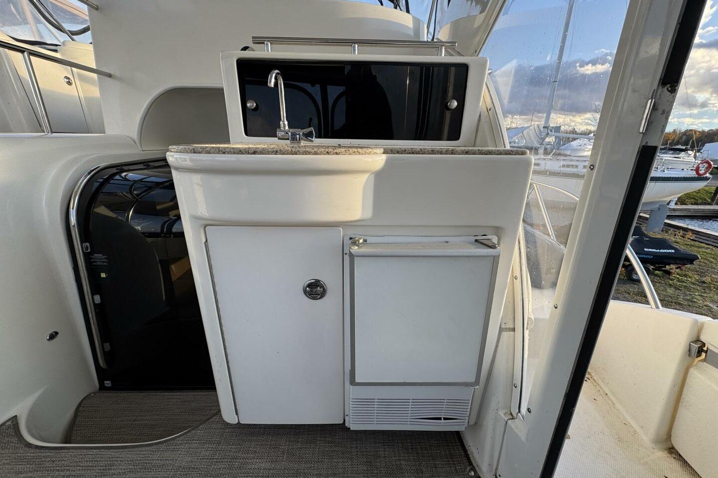 2008 Meridian 459 Motoryacht interior with sink and storage, showcasing sleek design.