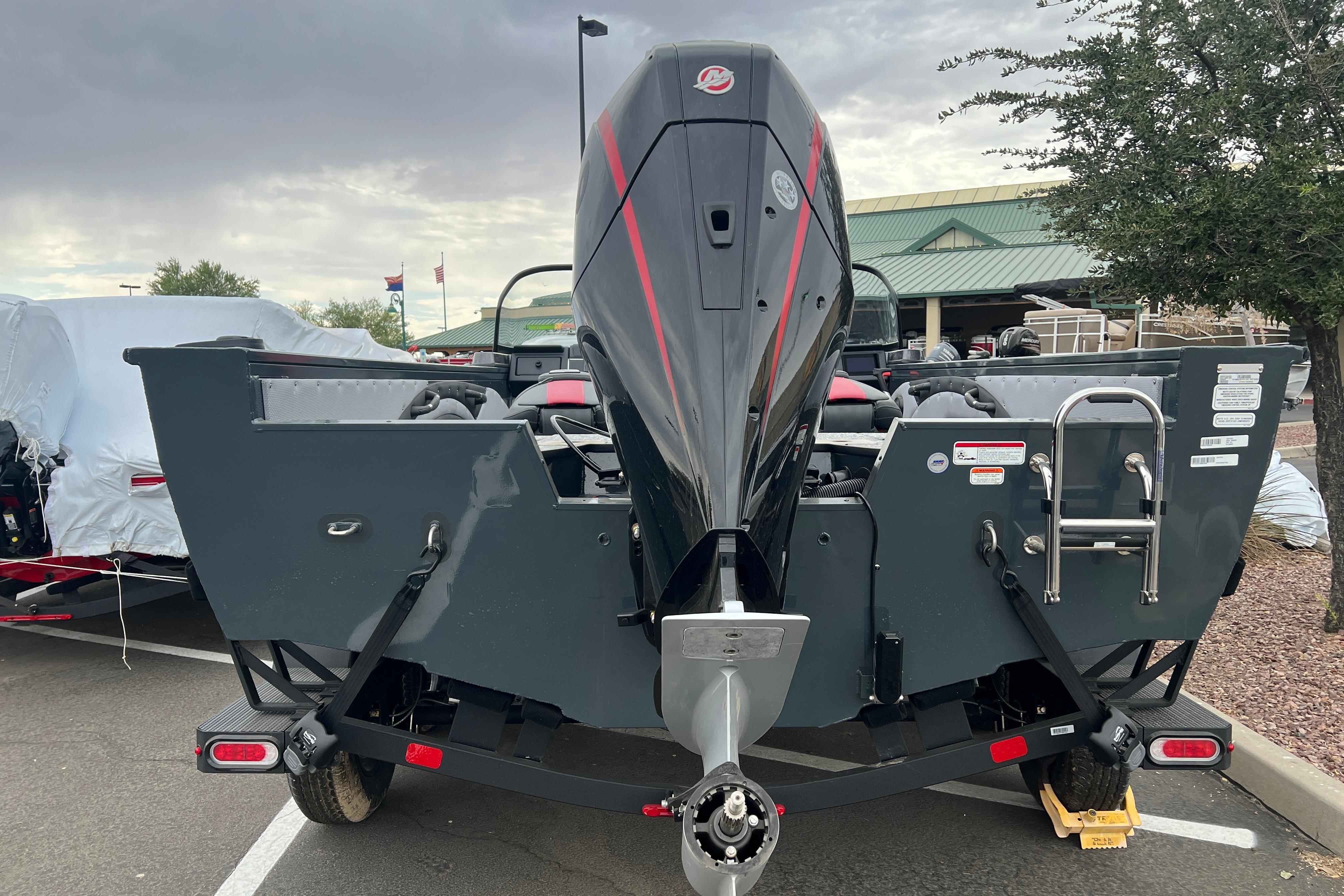 2026 Ranger VX1988 WT boat with powerful outboard motor, parked outdoors.