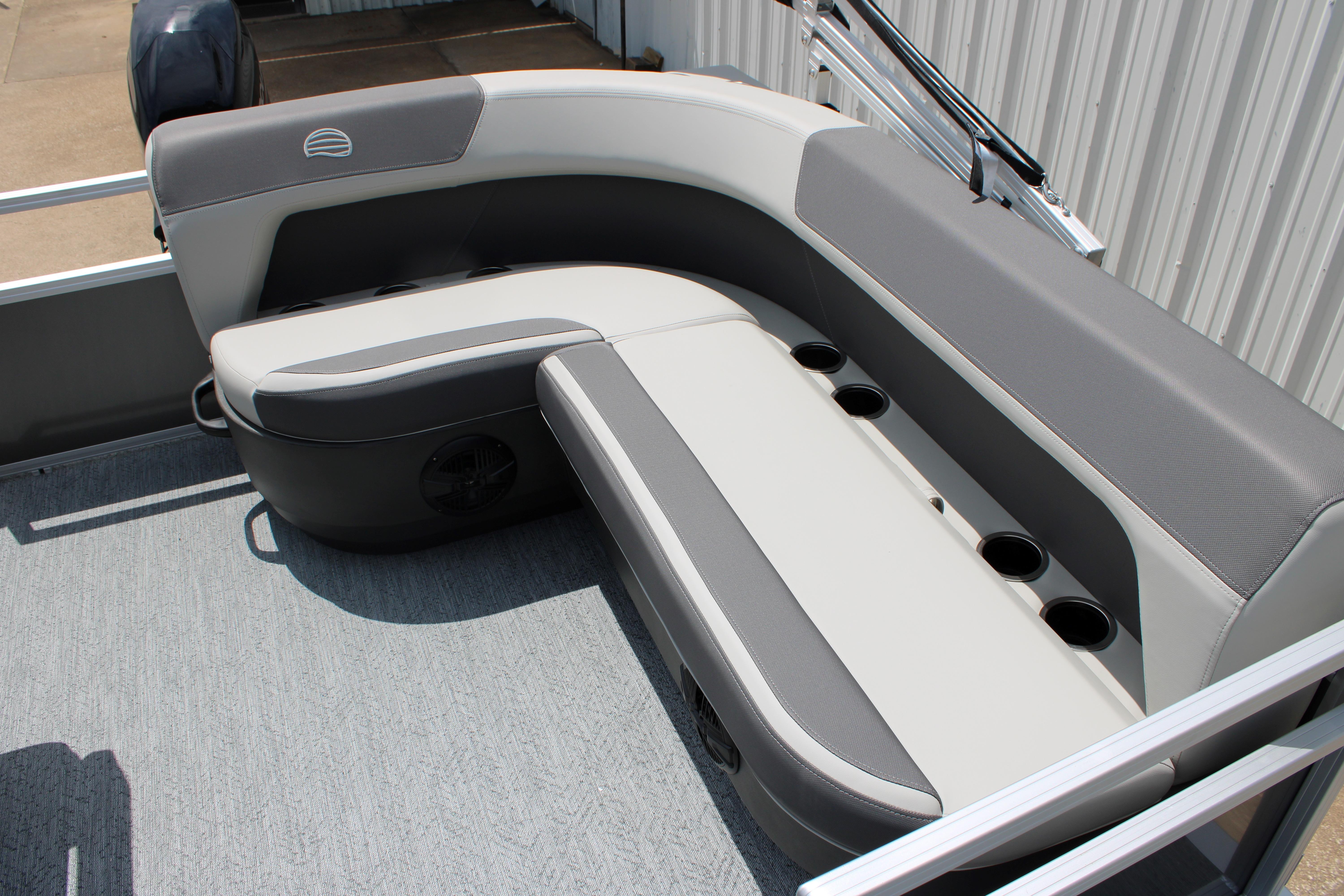 2026 Sun Tracker Bass Buggy 18 DLX pontoon boat seating with cup holders.