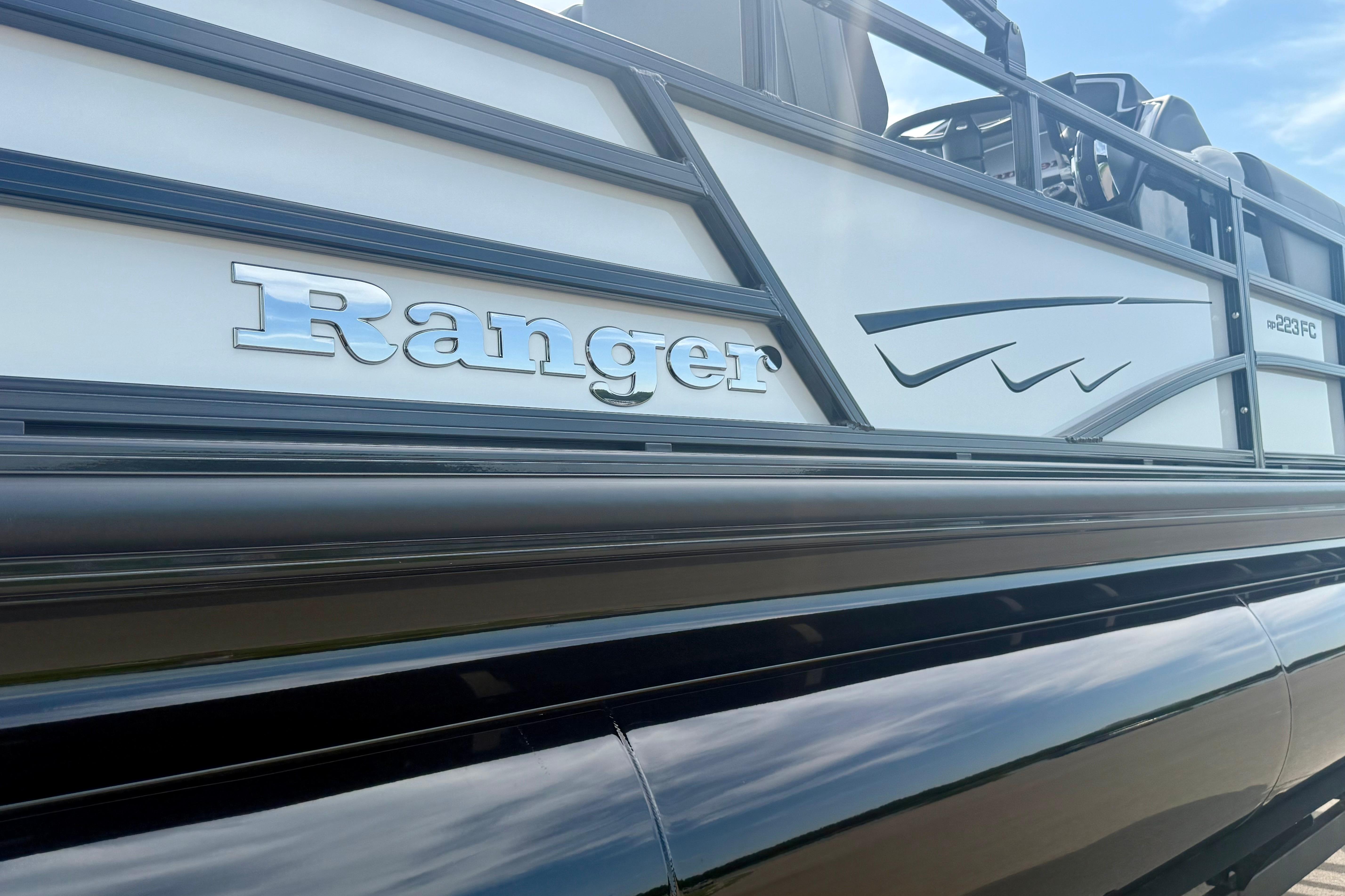 2026 Ranger 223FC boat side view with sleek design and logo.