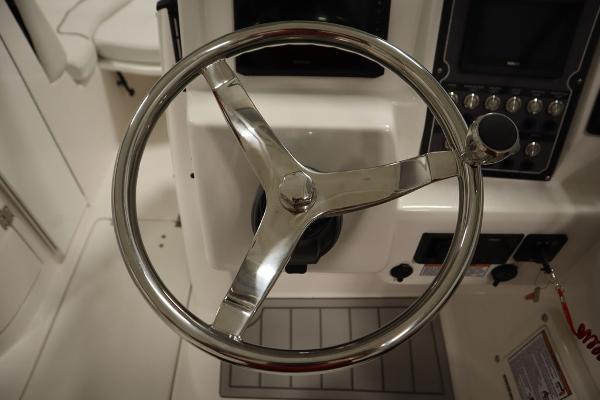 Steering wheel of 2025 Sea Fox 228 Traveler boat cockpit.