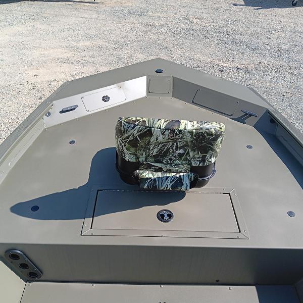 2025 Tracker Grizzly 1754 SC boat interior with camo seat and storage compartment.