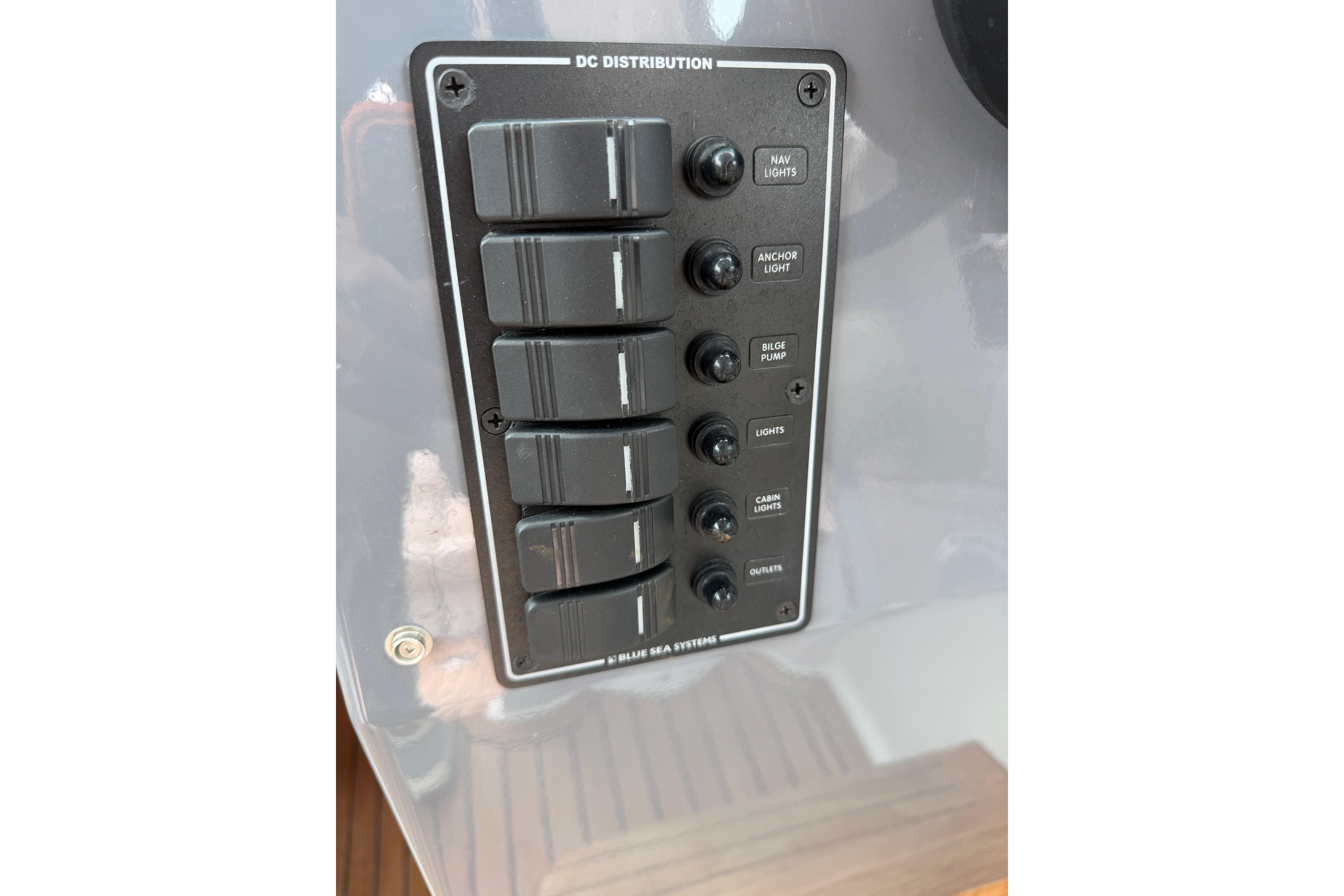 Control panel of a 2016 Protector Targa 30 boat, featuring labeled switches.