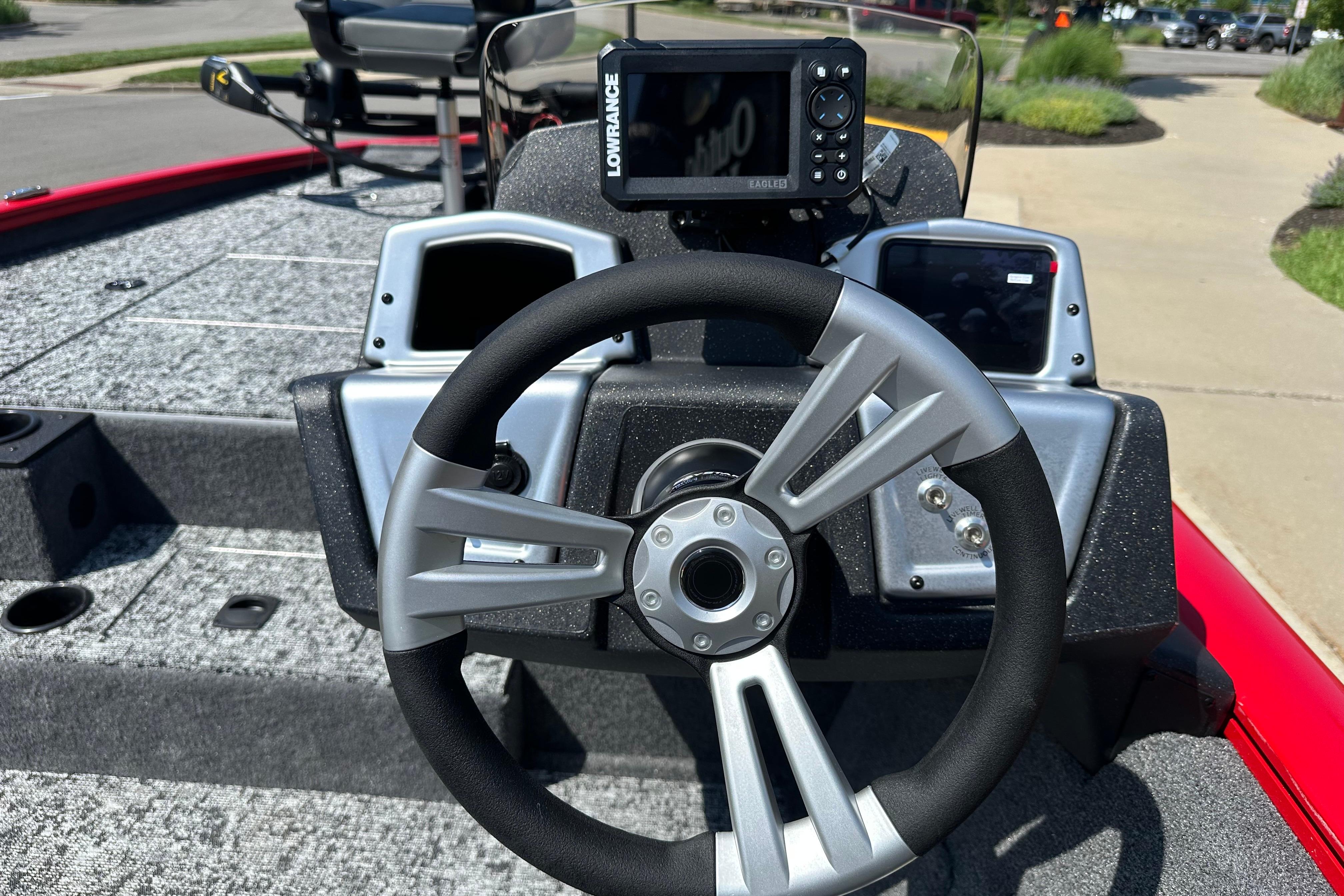 Steering console of 2026 Tracker Pro Team 195 boat with navigation display.