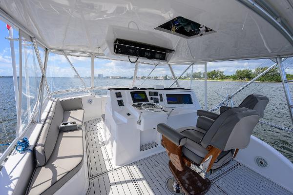 Helm of 2000 Viking 50 Convertible yacht with modern controls and seating.