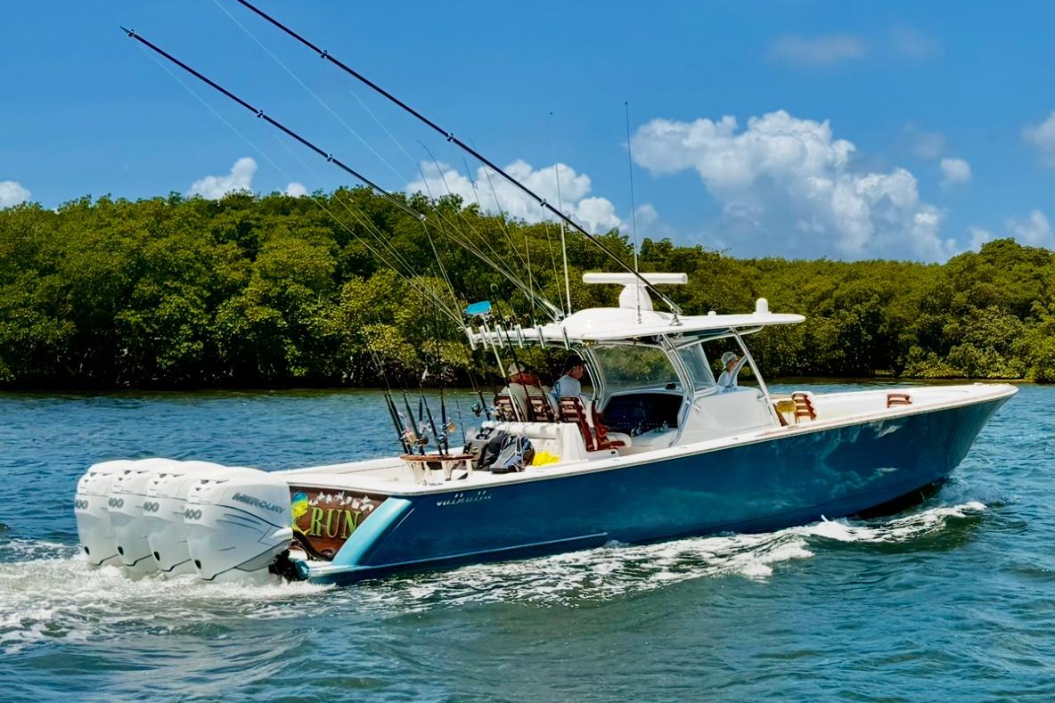 2020 Valhalla Boatworks V-41 cruising on a sunny day with fishing rods.
