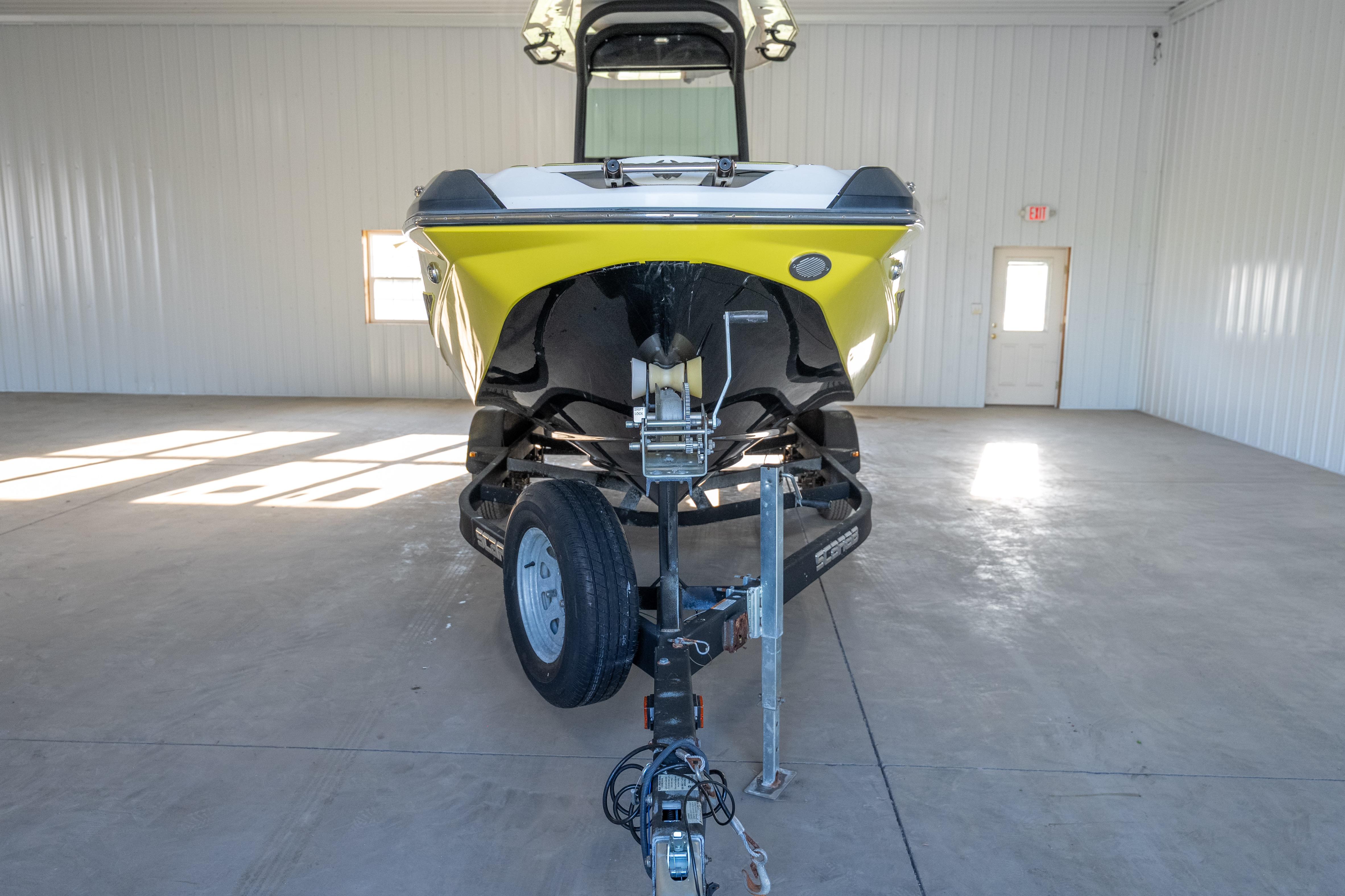 2022 Scarab 255 Open ID boat on trailer in spacious indoor storage.