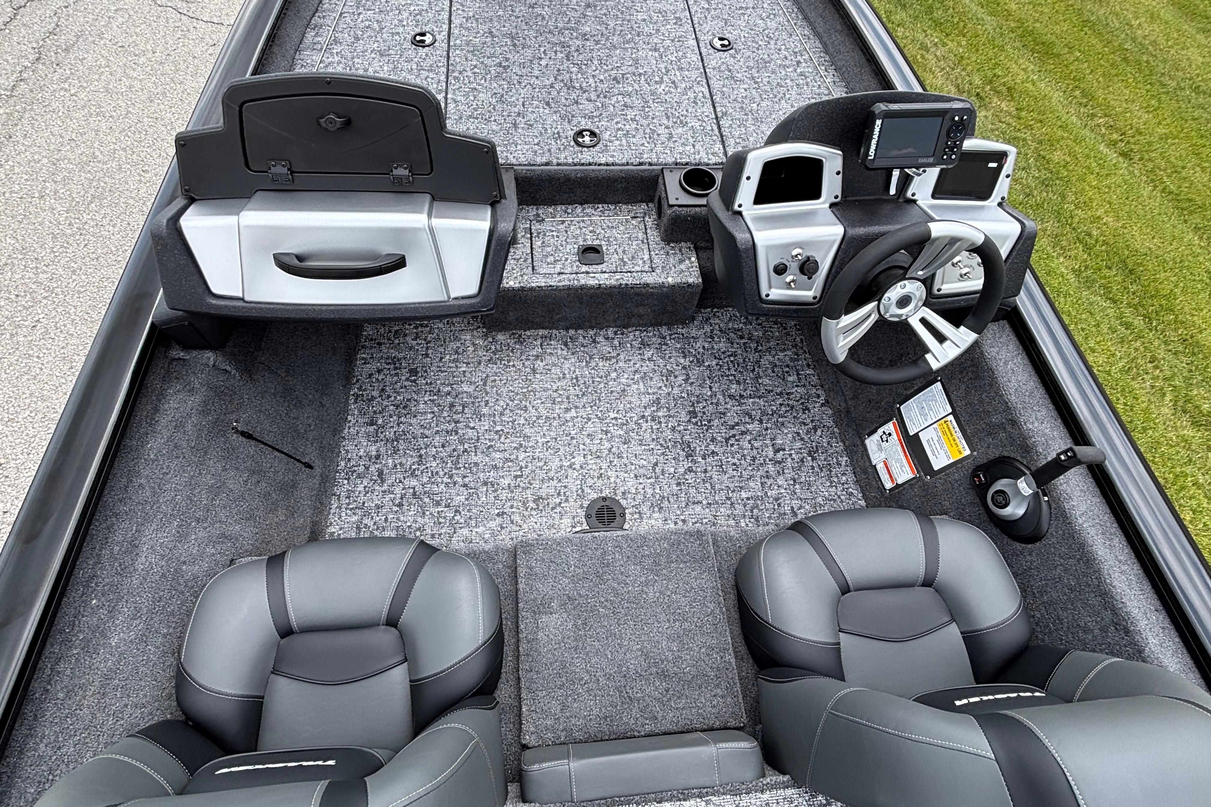 2026 Tracker Pro Team 190 boat interior with steering console and seating.