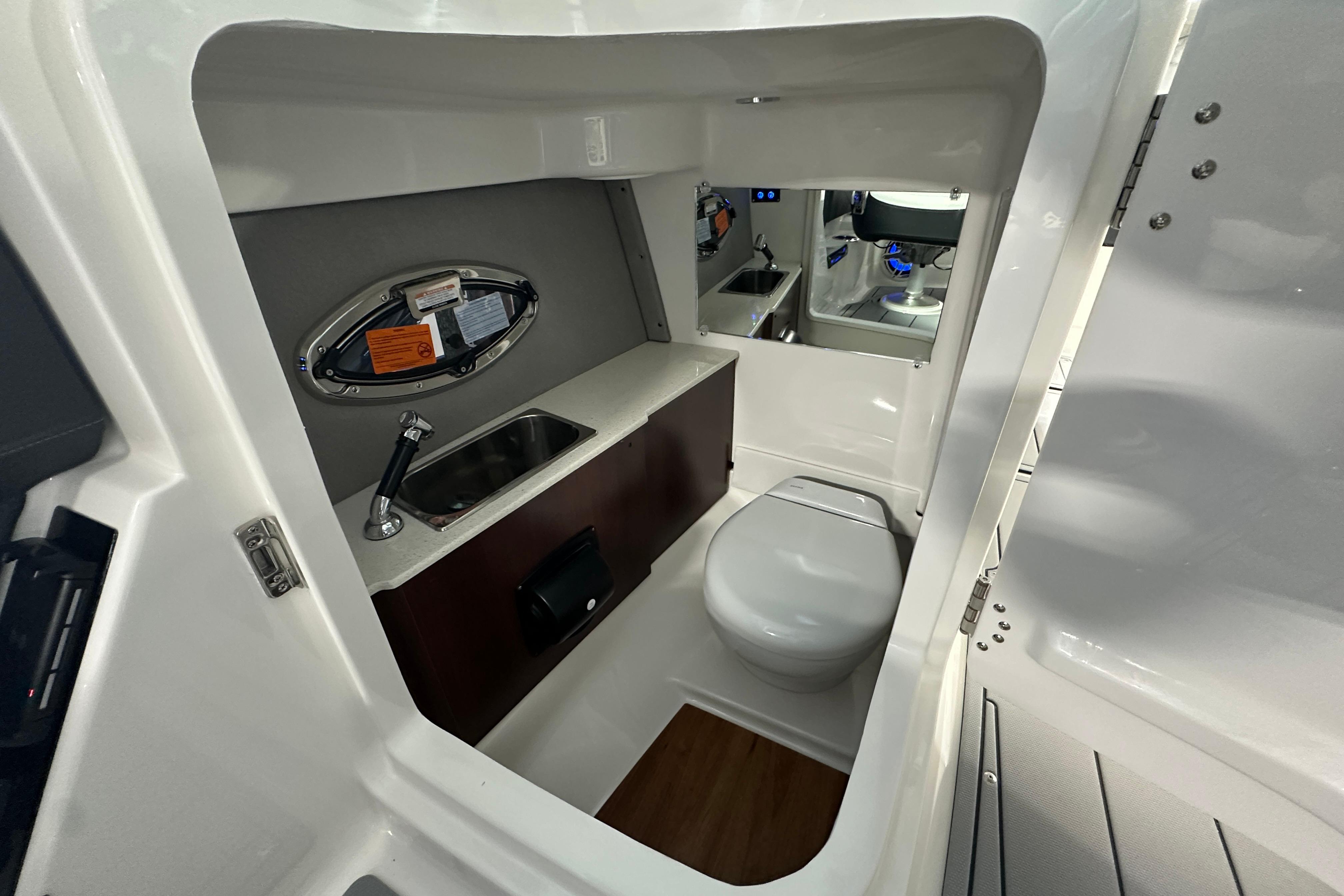 Interior of 2026 Chaparral SSX 8 with toilet and sink.