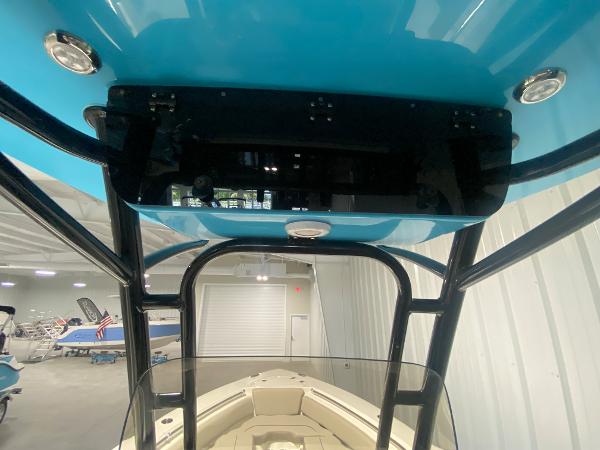 2024 Key West 219 FS boat interior, view of the T-top and bow area in a showroom.