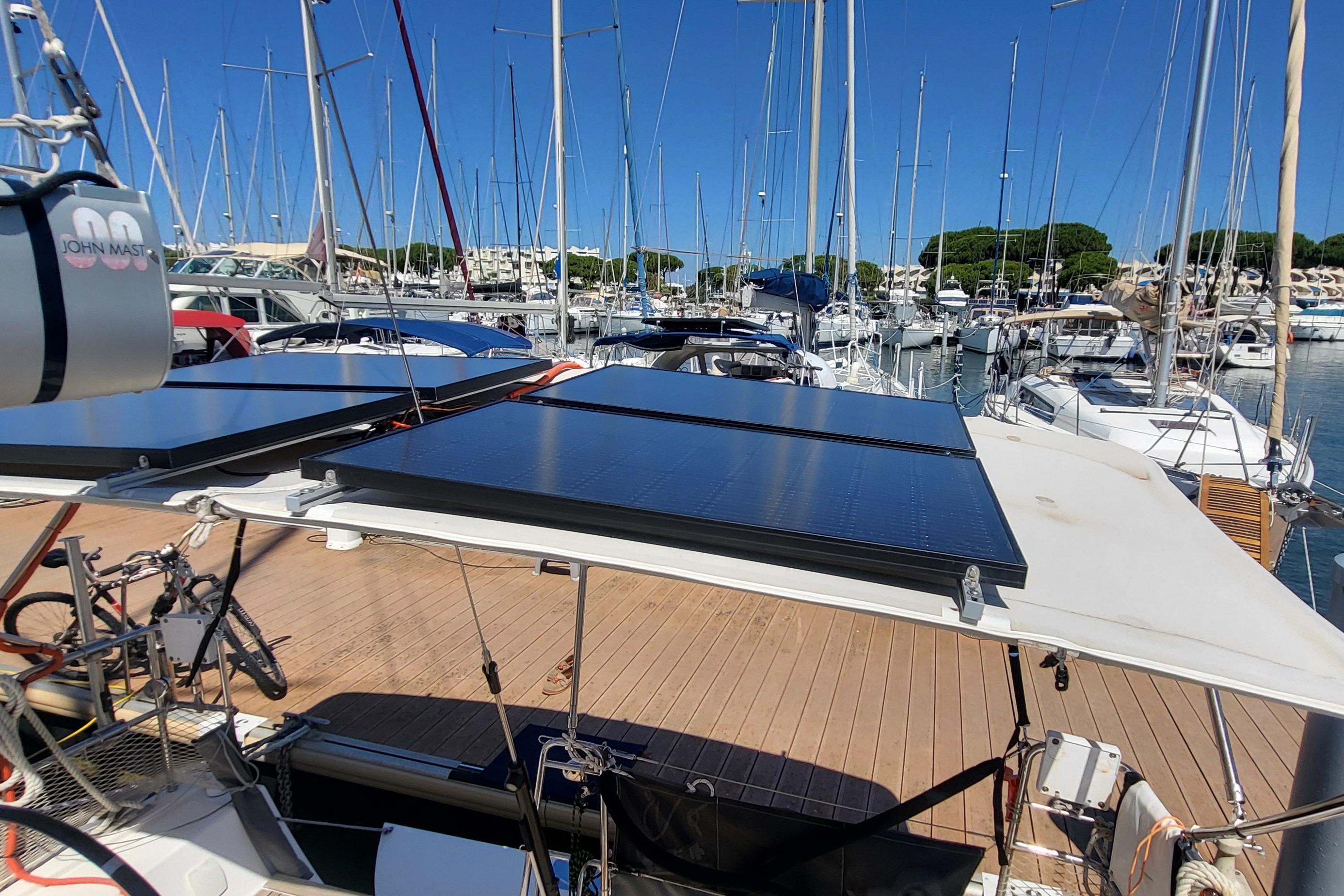 Sailboat with solar panels docked at marina, X-Yachts Xp 38, 2016 model.