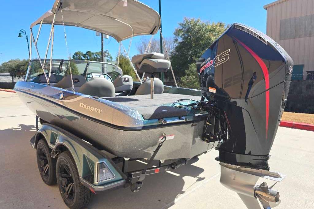2026 Ranger 212LS boat with powerful outboard motor, parked outdoors.