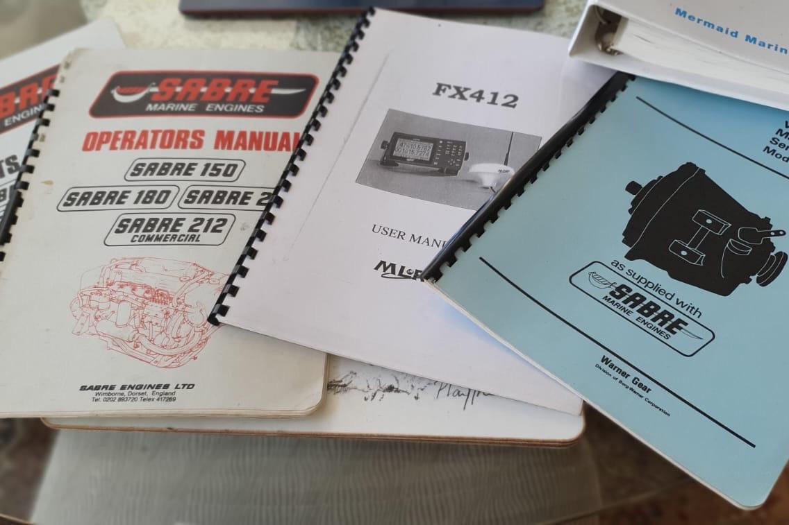 Manuals for Sabre Marine Engines and FX412 on a table, related to Fairey Spearfish MKIII.