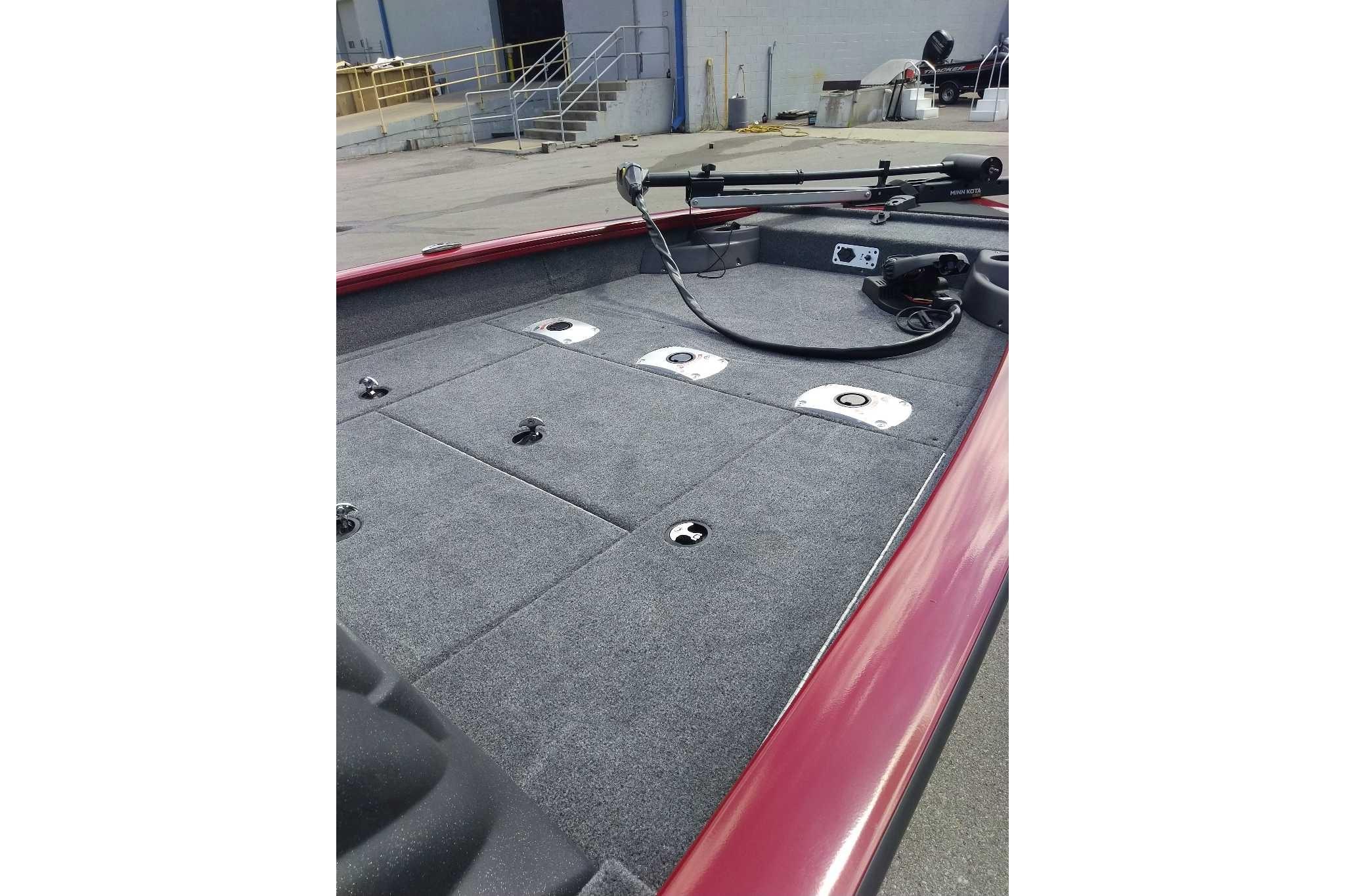 2026 Tracker Pro Team 175 Crappie Edition boat deck with carpeted surface and fishing equipment.