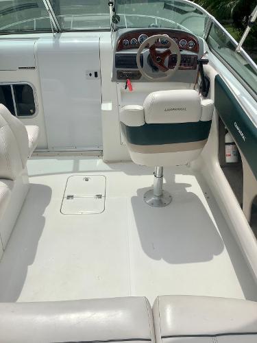 1998 Chaparral 2335 SS boat interior with captain's chair and dashboard.