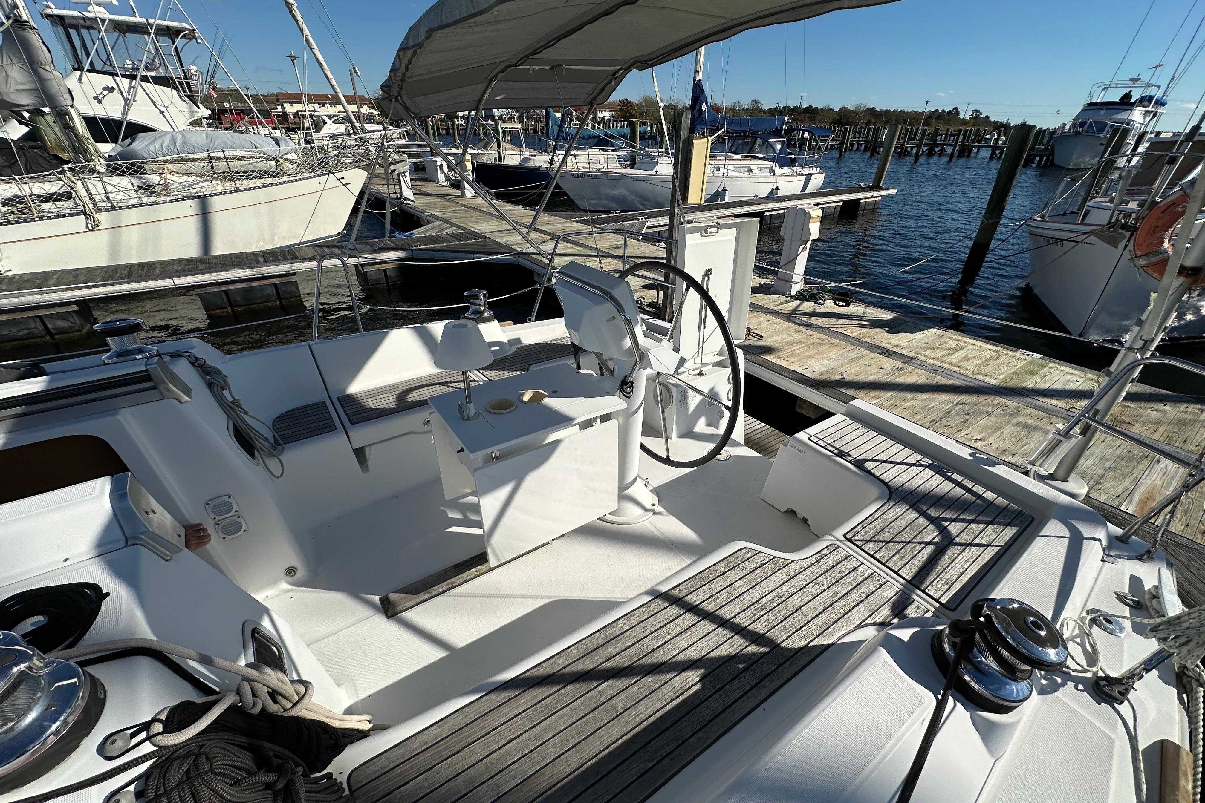 Cockpit of 2015 Beneteau Oceanis 37 sailboat docked at marina.