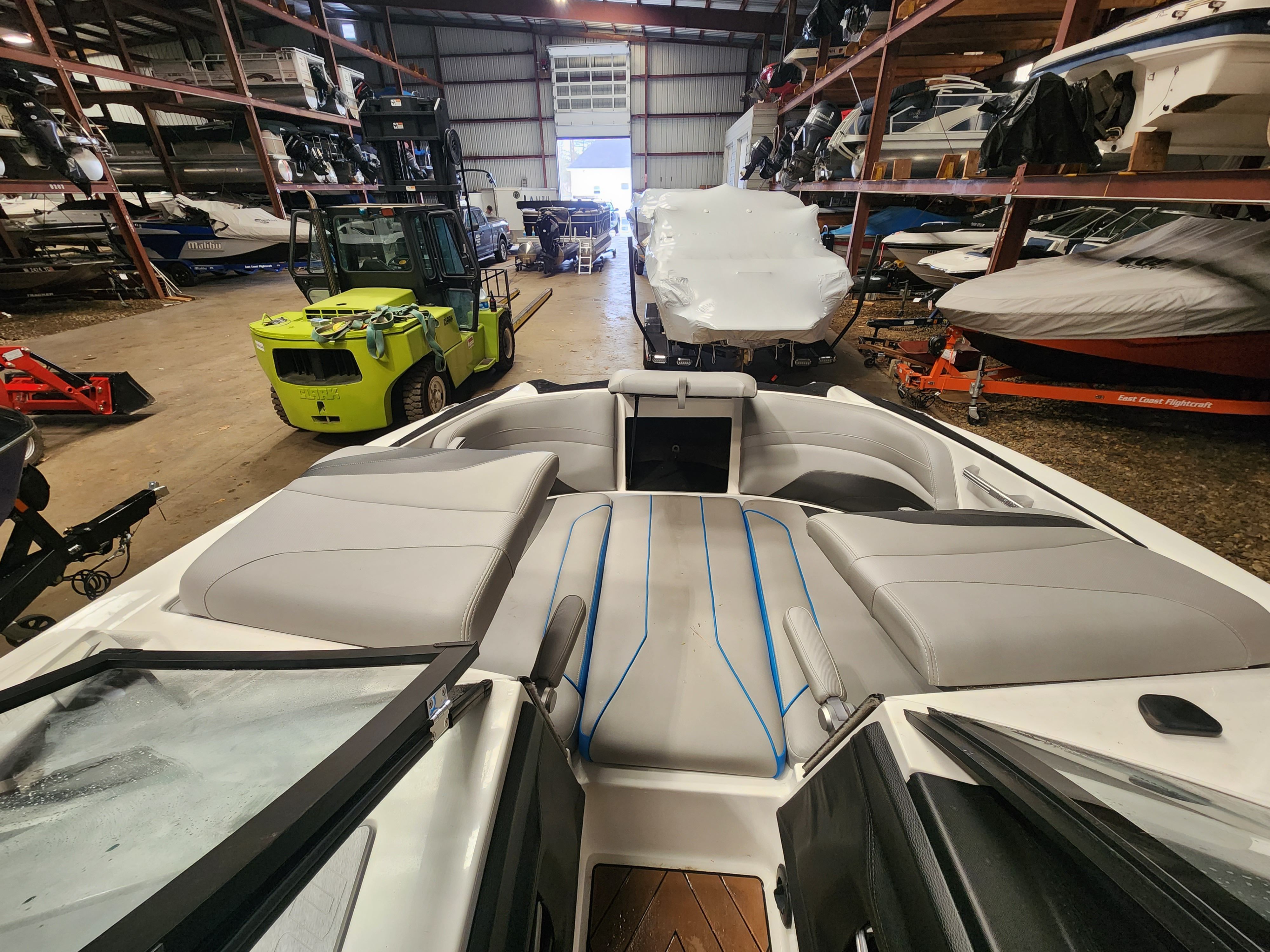 Interior view of a 2017 Malibu Wakesetter 24 MXZ in storage facility.