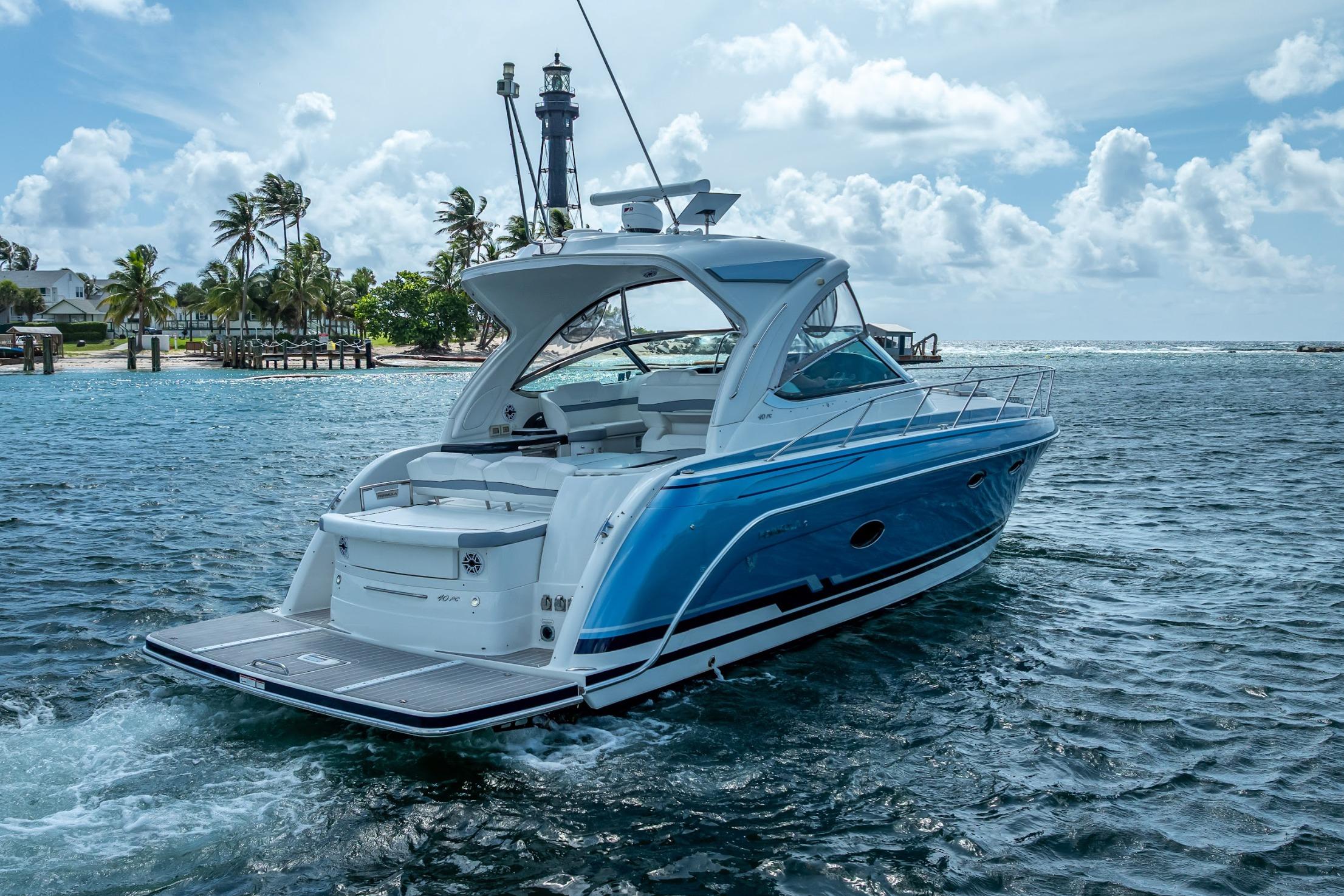2022 Formula 40 Performance Cruiser on scenic ocean with lighthouse backdrop.