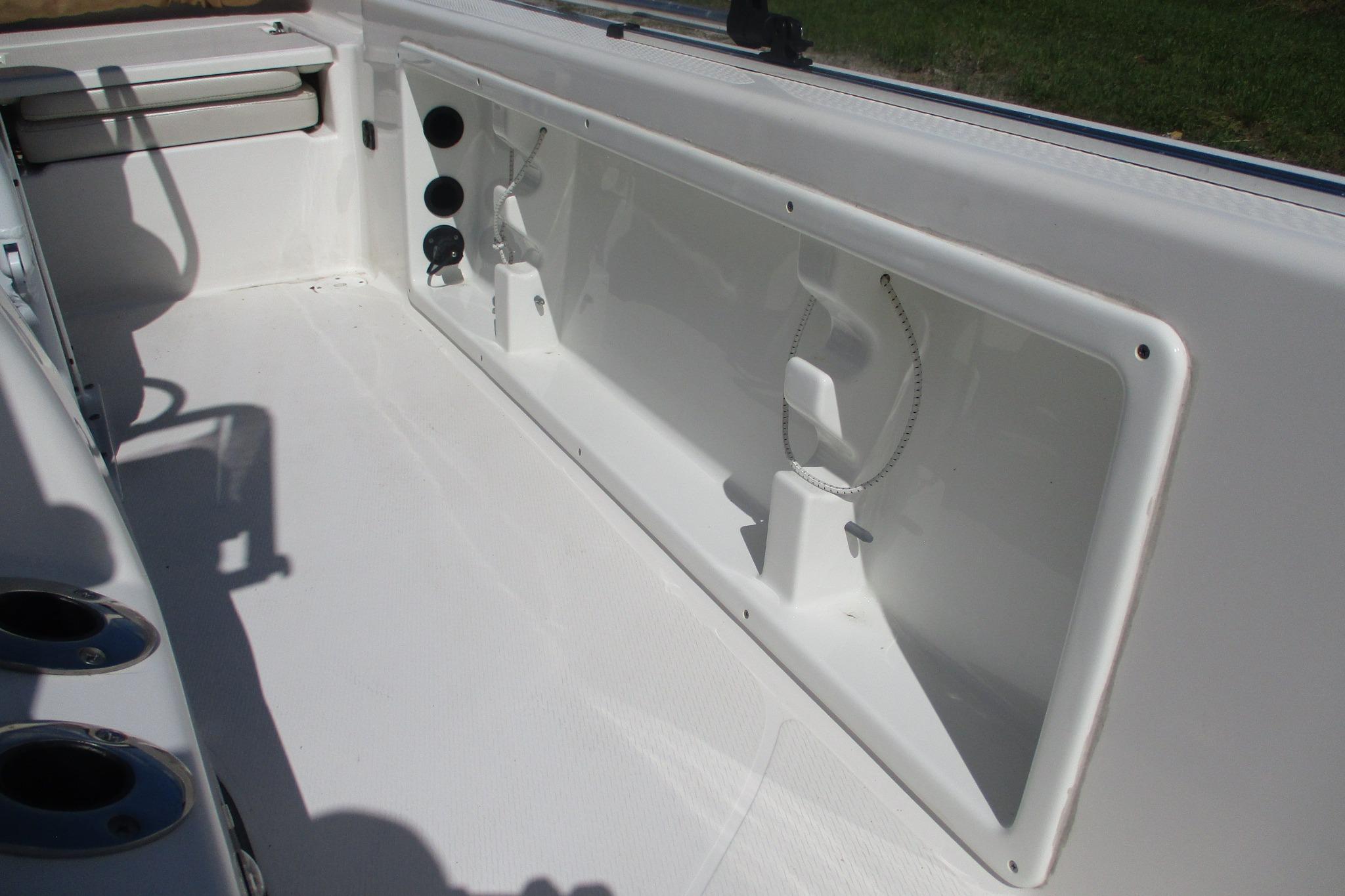 Interior view of a 2021 Blue Wave 2000 PureBay boat, showcasing storage compartment.