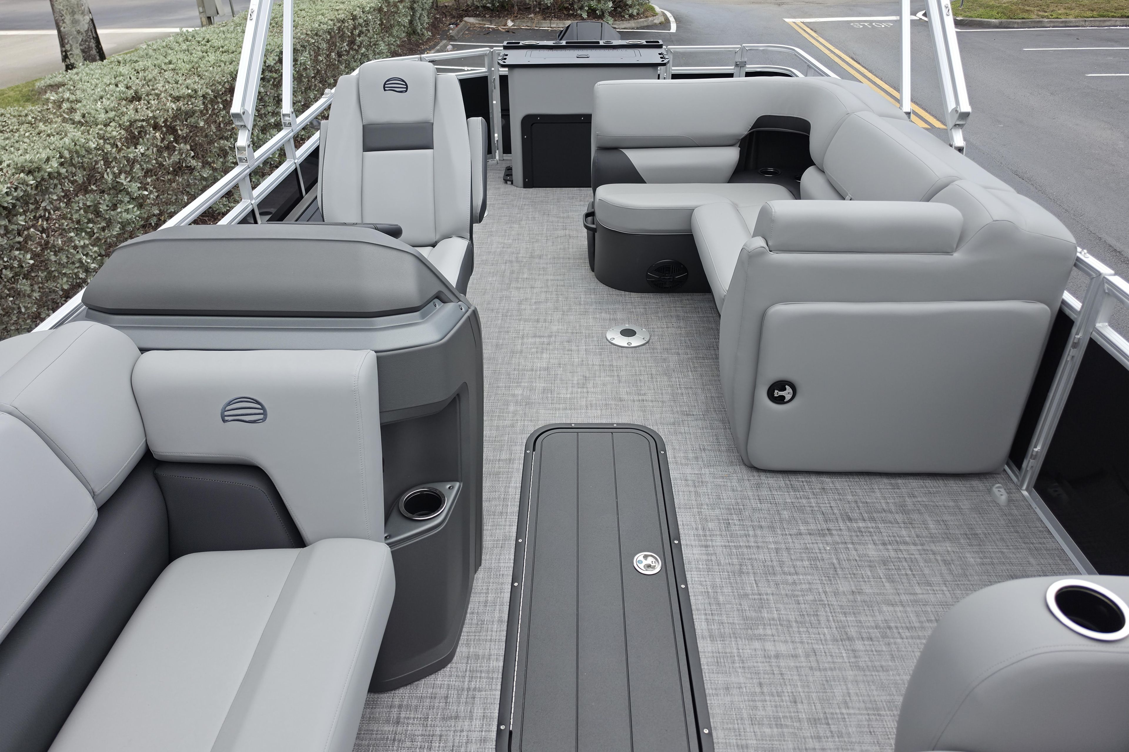 2026 Sun Tracker SportFish 22 XP3 pontoon boat interior with gray seating and spacious layout.