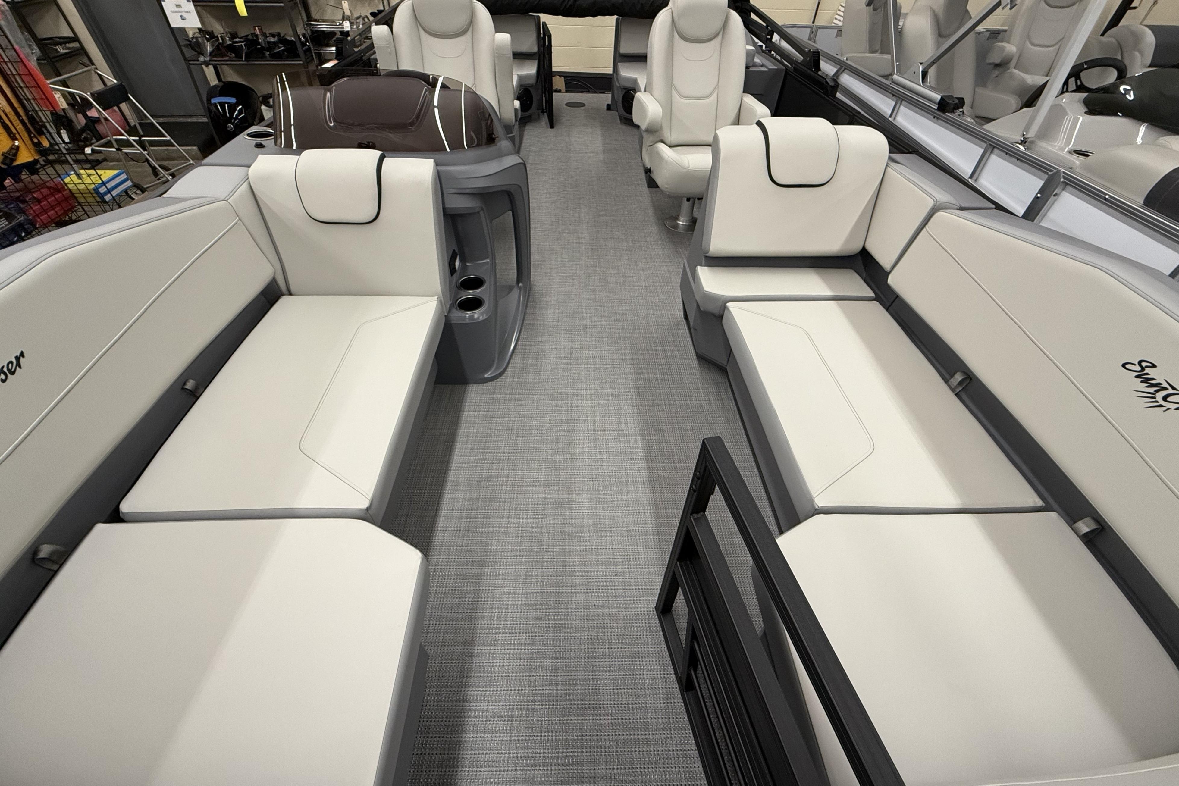 Luxurious interior of 2025 SunChaser Lucerne 22 LR DH pontoon boat with plush seating.