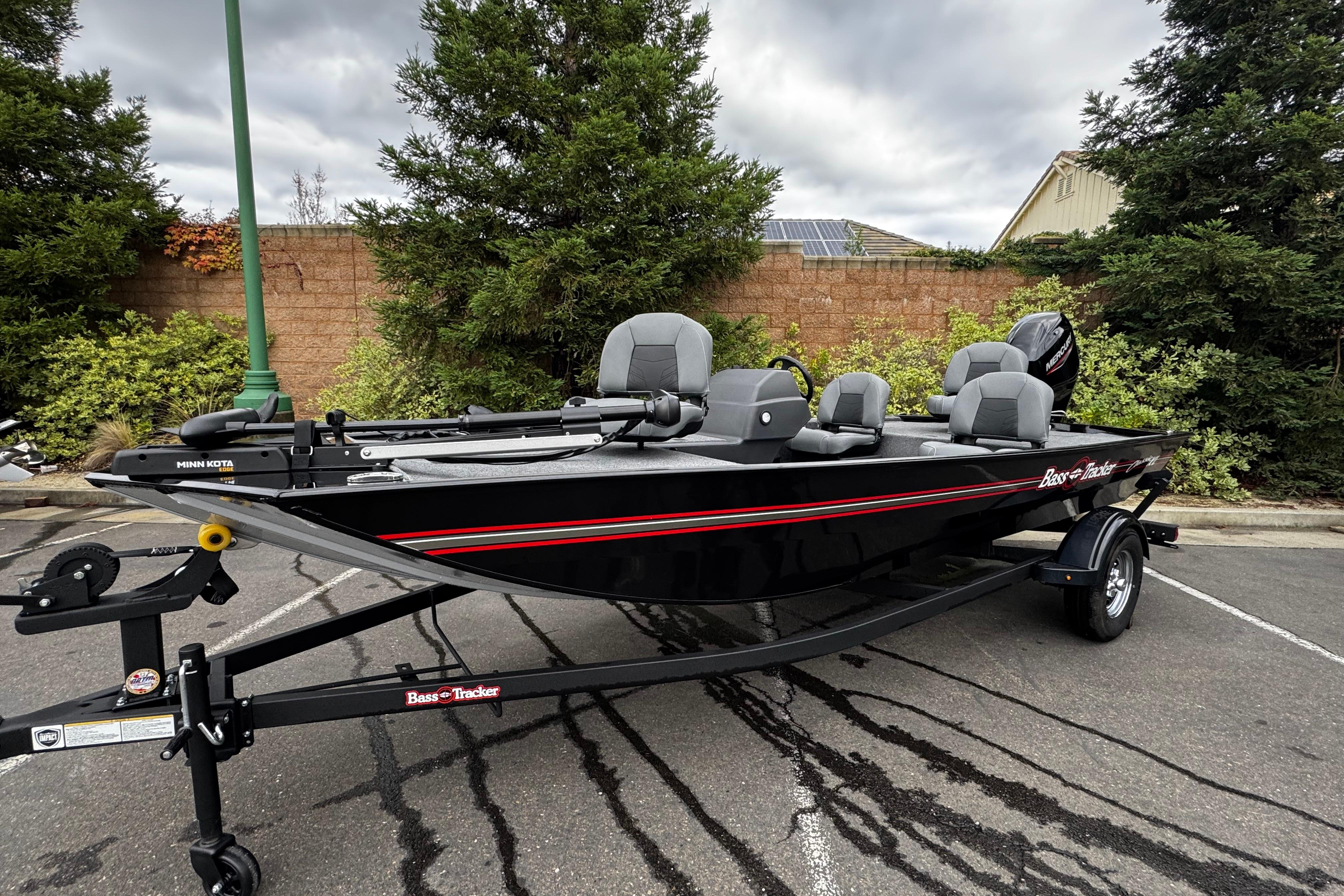 2026 Tracker Bass Tracker Classic XL fishing boat on trailer, parked outdoors.