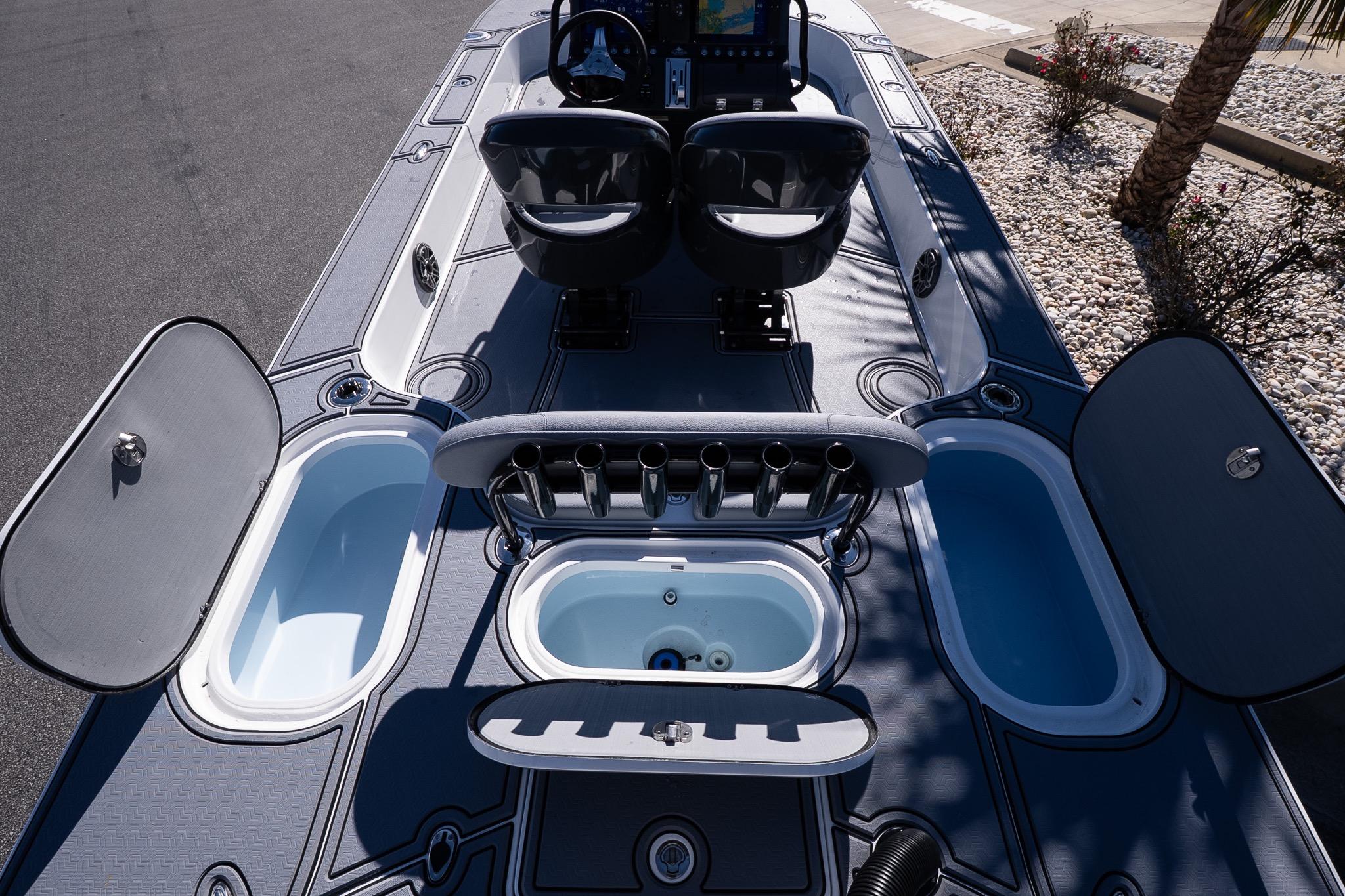 2026 Turner Boatworks 24 SAVAGE deck with storage compartments and seating.