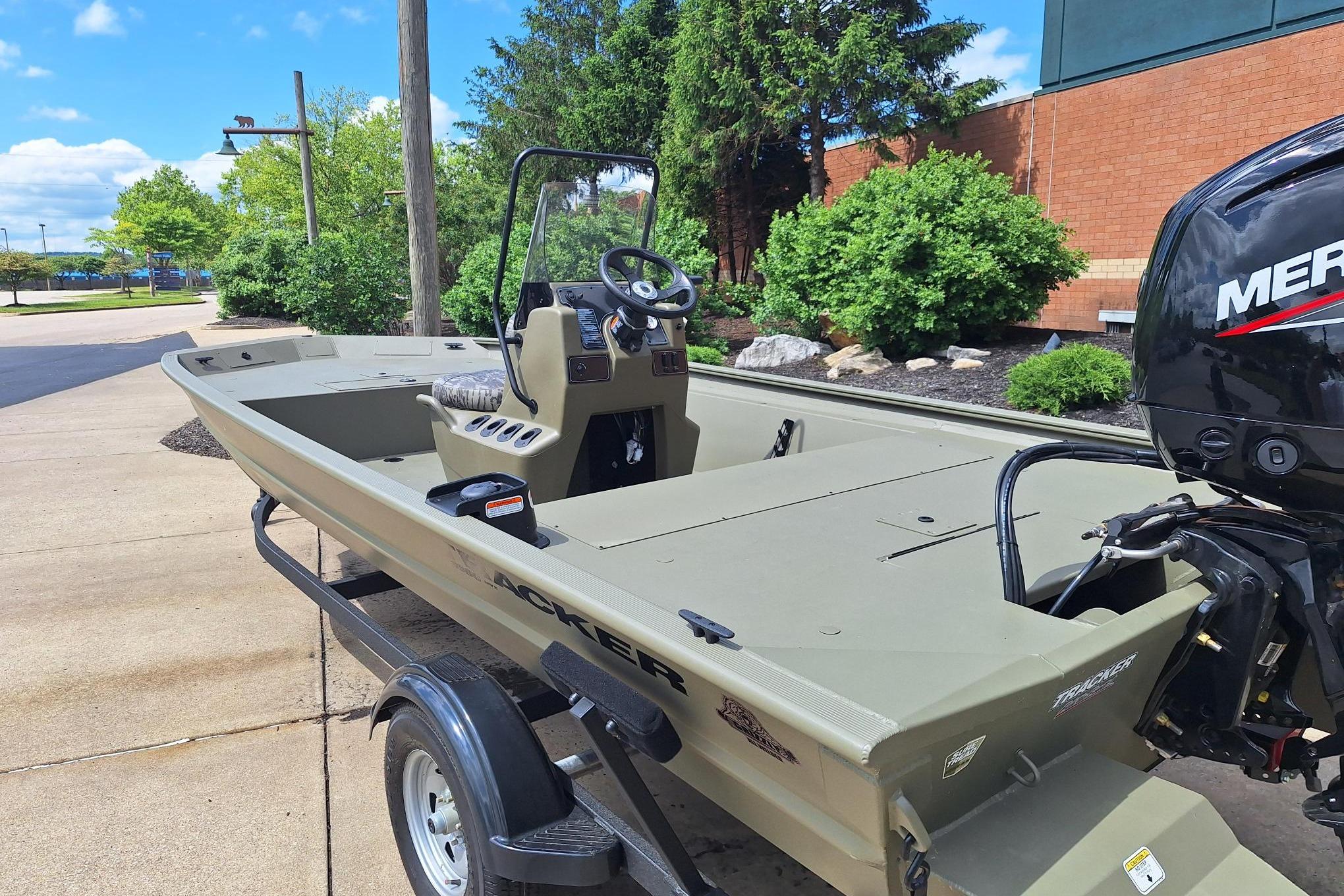 2026 Tracker Grizzly 1860 CC boat with Mercury engine on trailer.