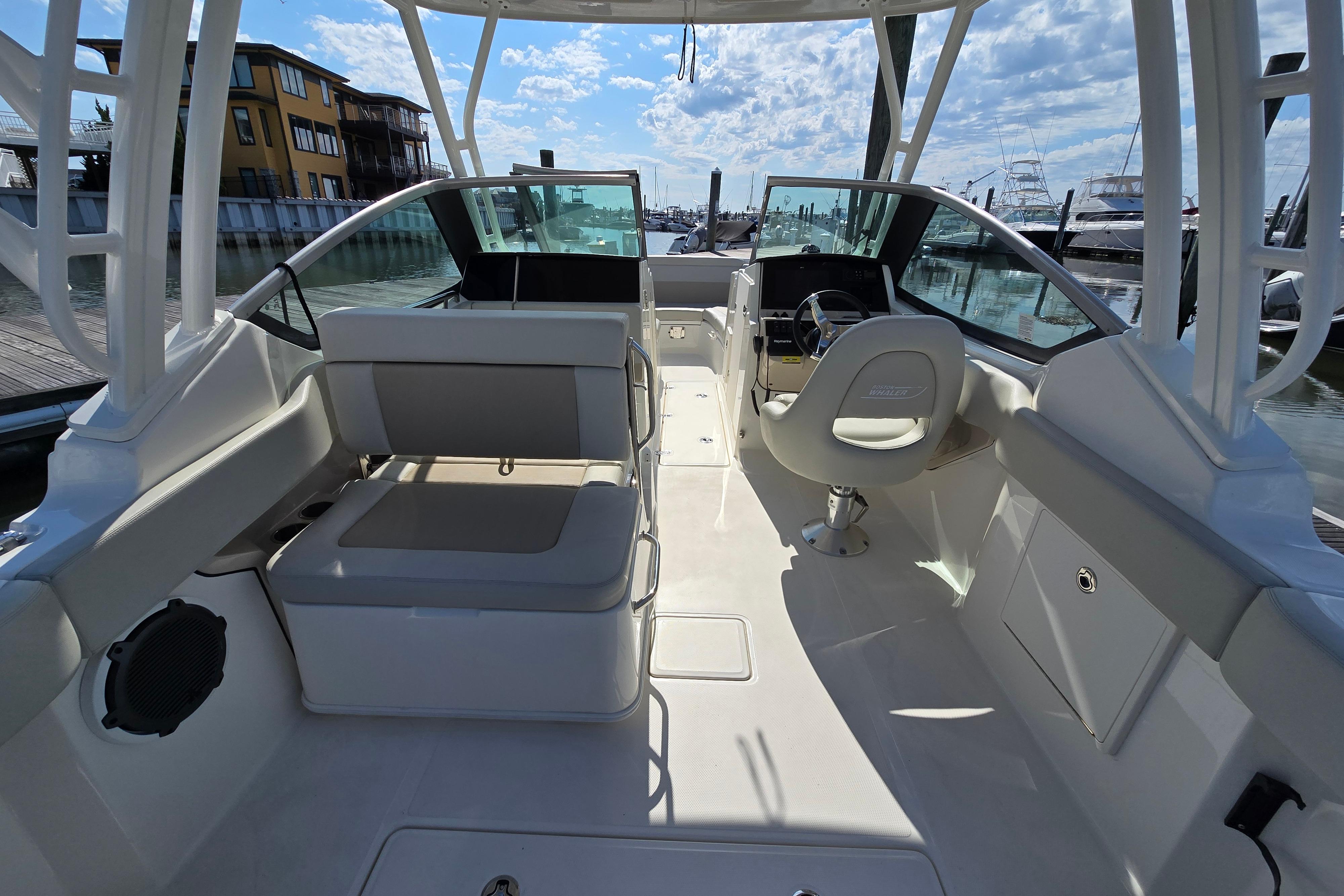 2022 Boston Whaler 240 Vantage boat interior with seating and steering wheel.