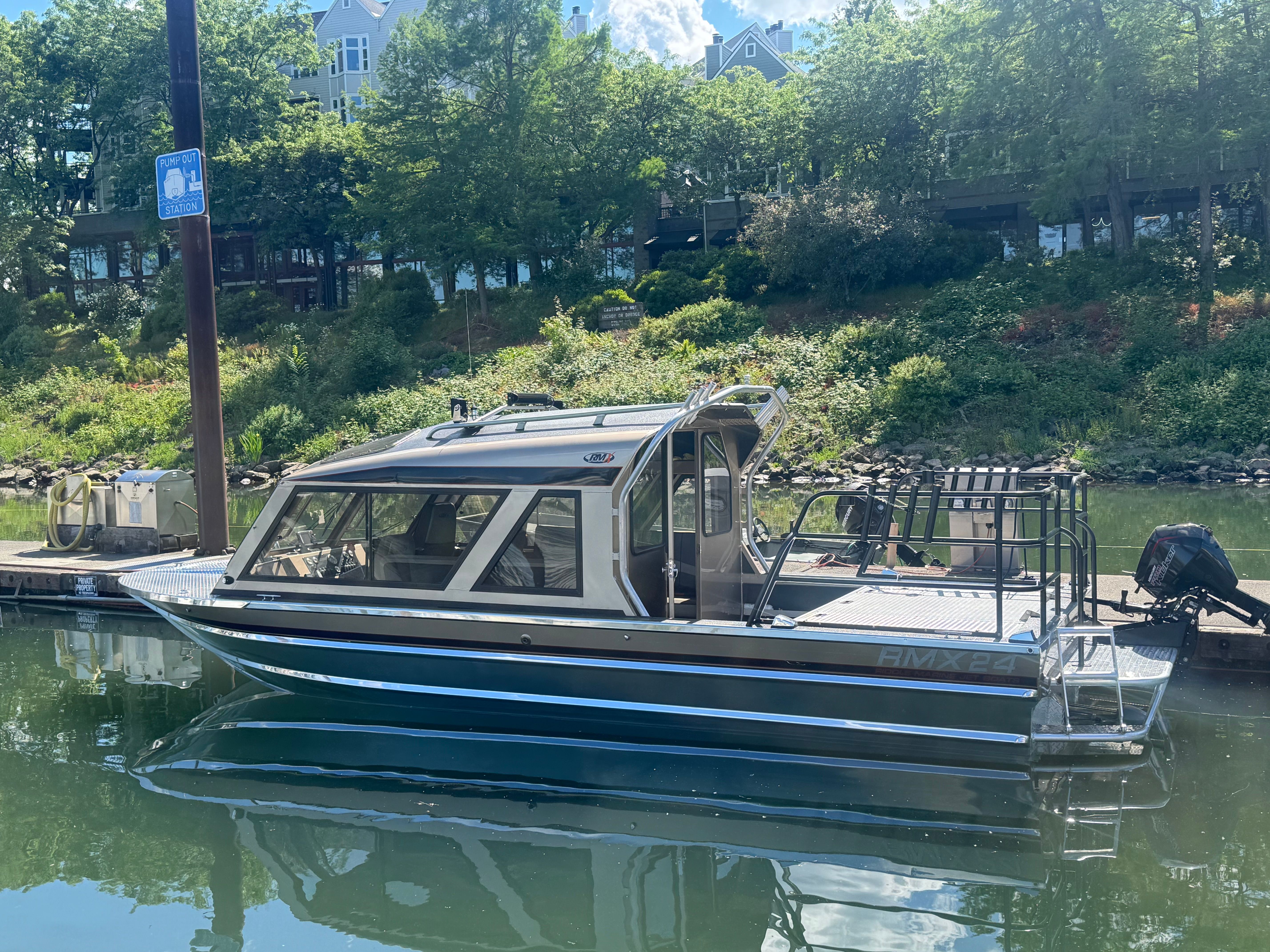 Custom RMX 24 boat from 2011 docked.