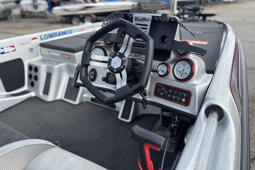 2020 Bass Cat Cougar FTD boat dashboard with steering wheel and gauges.