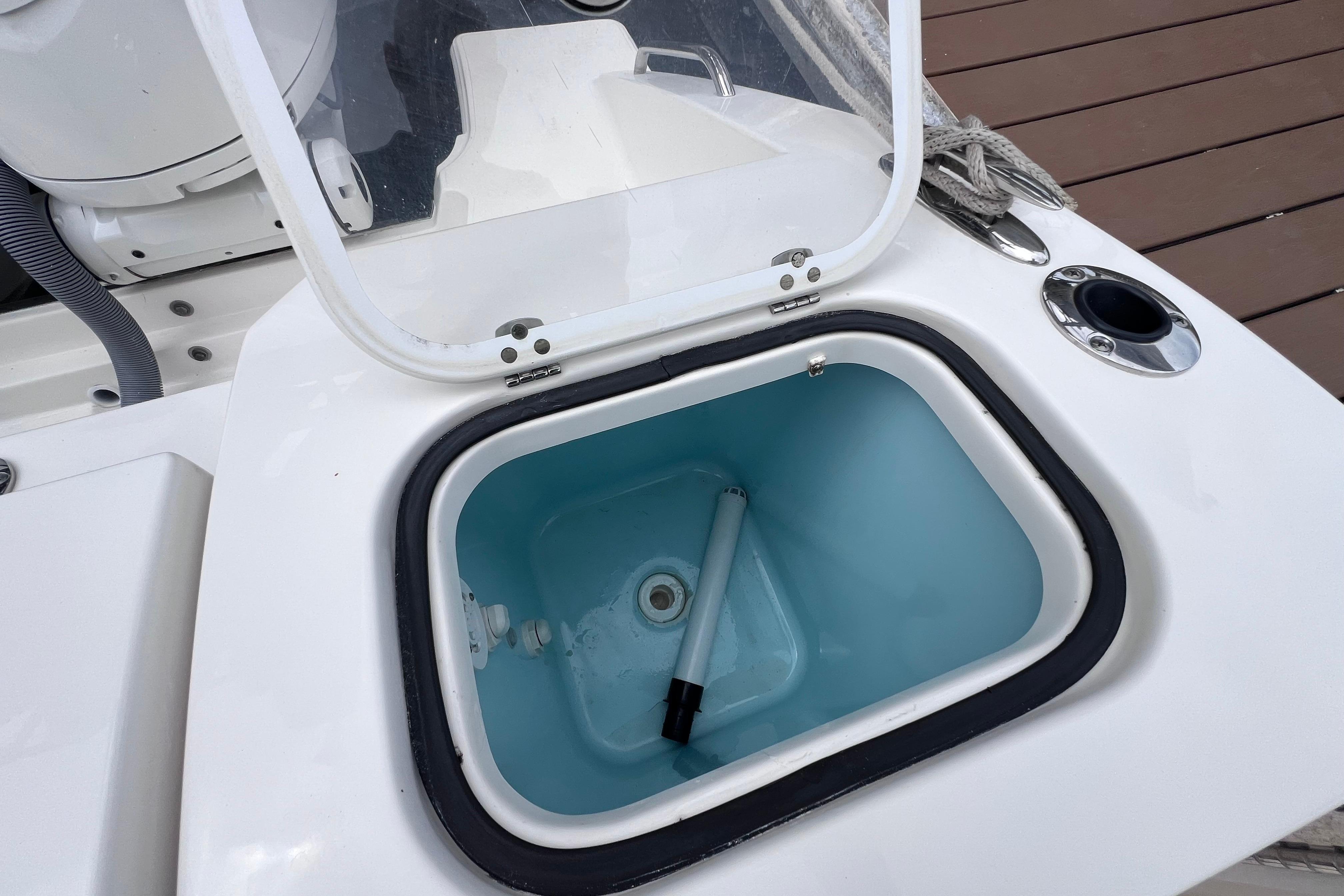 Open storage compartment on 2022 Pursuit S 288 Sport boat deck.