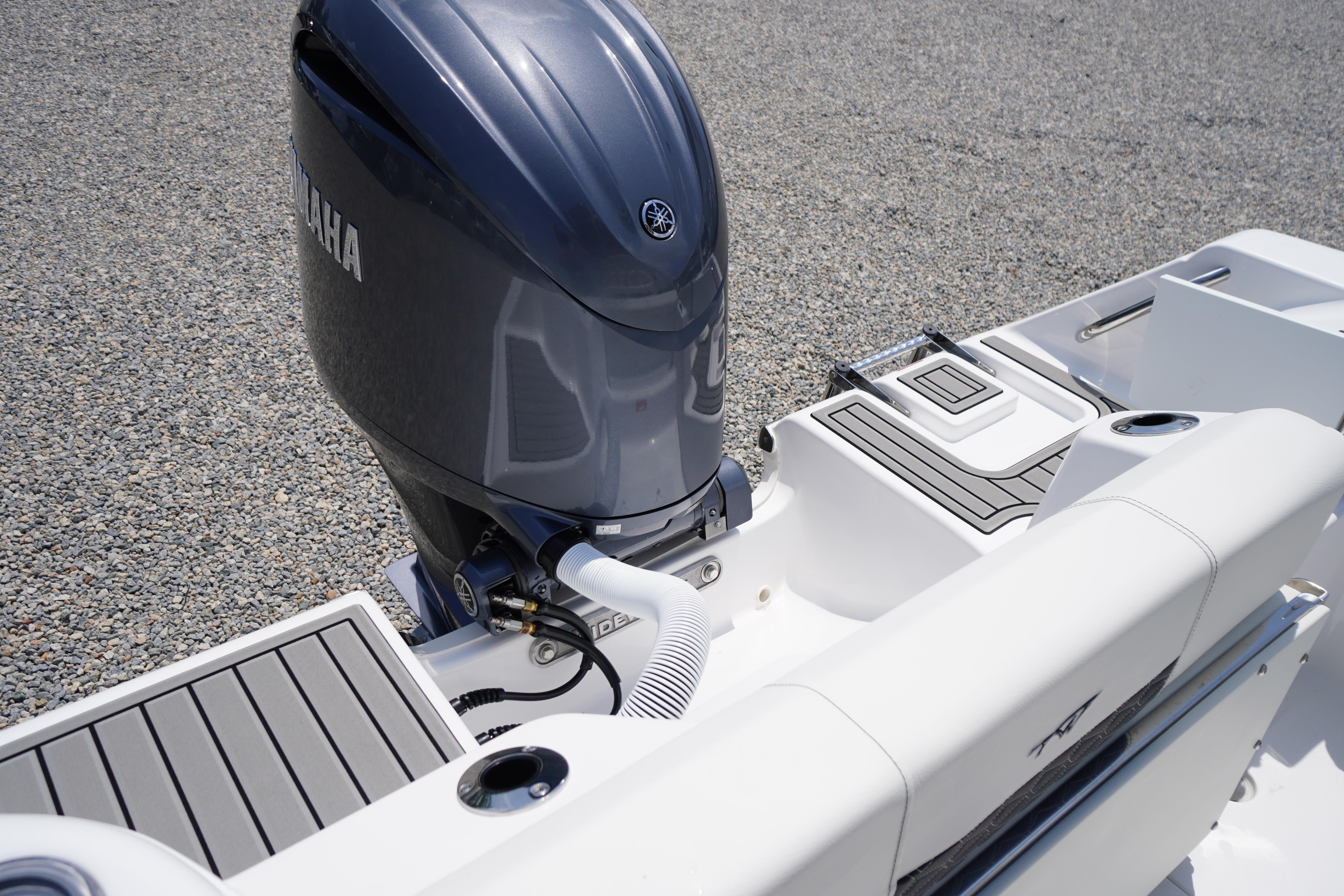 2027 Tidewater 220 CC Adventure boat with Yamaha outboard motor, featuring sleek deck design.