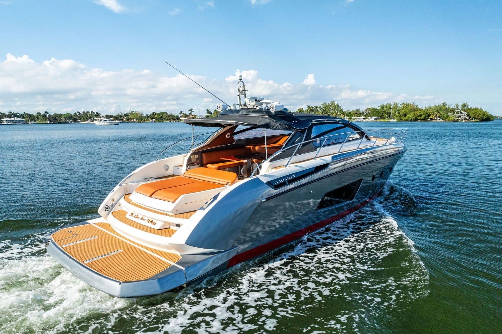 Luxury 2013 Azimut Atlantis 48 yacht cruising on a sunny day.